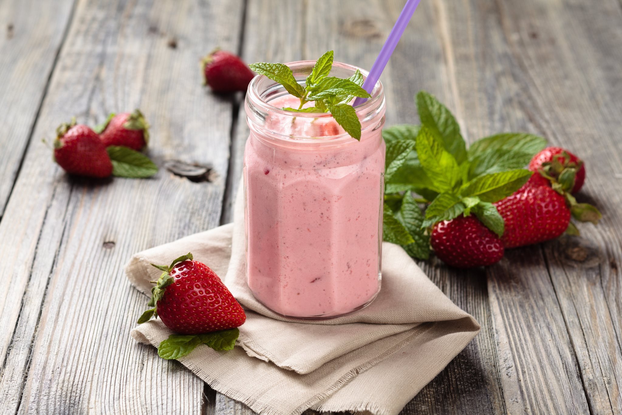 General 2048x1365 food strawberries closeup wooden surface mint leaves fruit depth of field wood drinking straw napkin glass jar smoothie drink