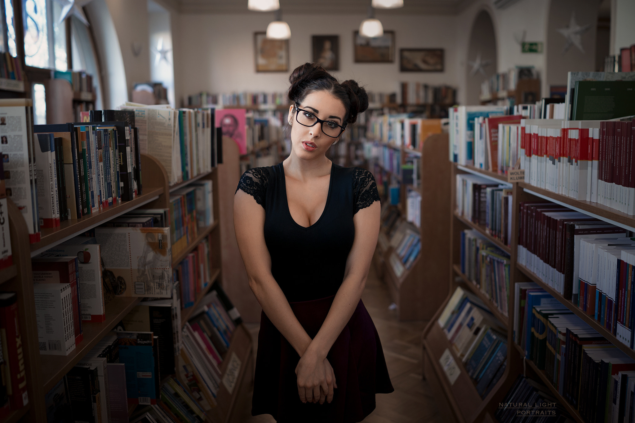 People 2048x1365 women portrait black clothing hairbun women with glasses books cleavage glasses watermarked library indoors Robert Chrenka bookshelves looking at viewer open mouth