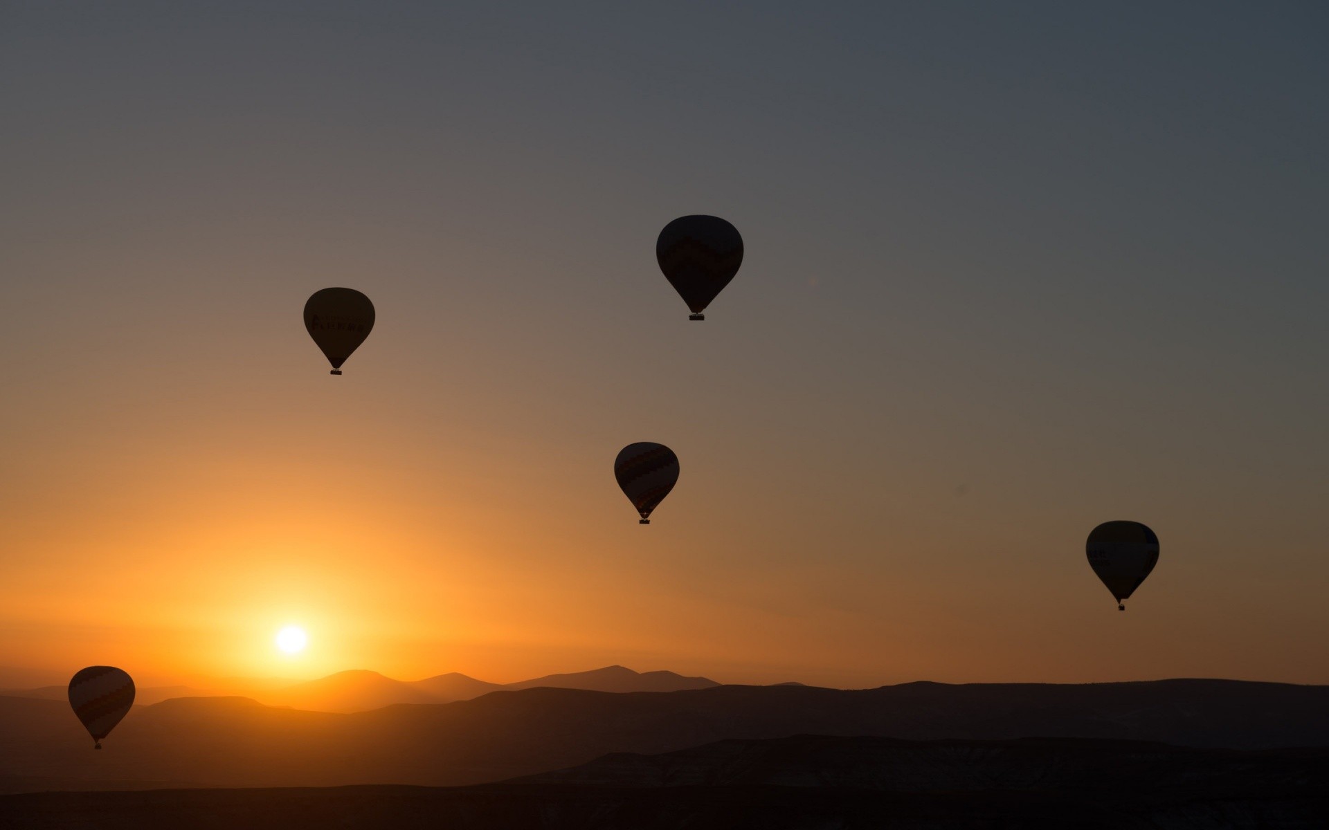 General 1920x1200 hot air balloons sunset mountains sky Sun vehicle sunlight low light
