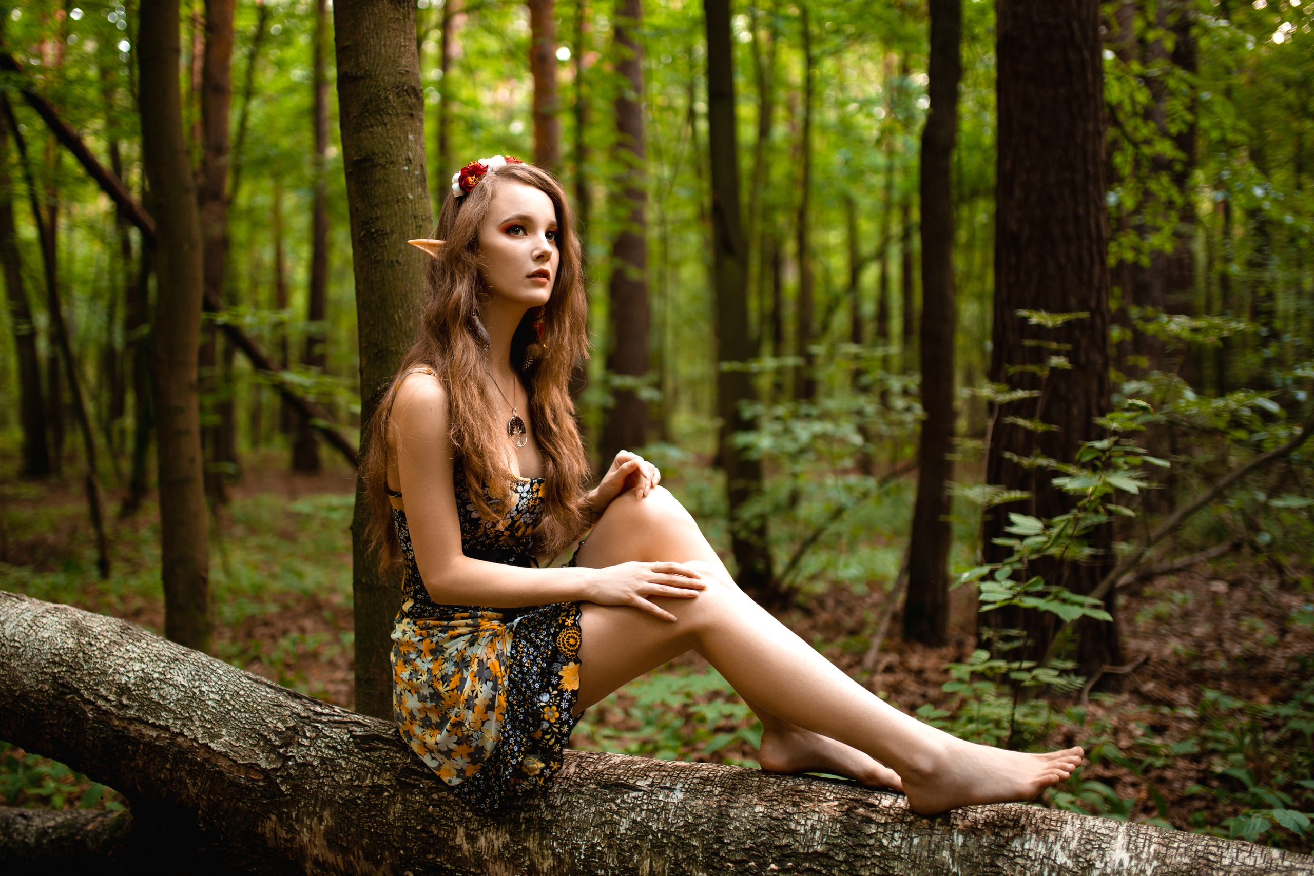 People 2560x1707 Ksana Stankevich women model brunette long hair looking away makeup elves pointy ears cosplay trees log dress outdoors depth of field women outdoors sitting flower in hair necklace fantasy girl barefoot cleavage forest ground leaves branch pointed toes parted lips