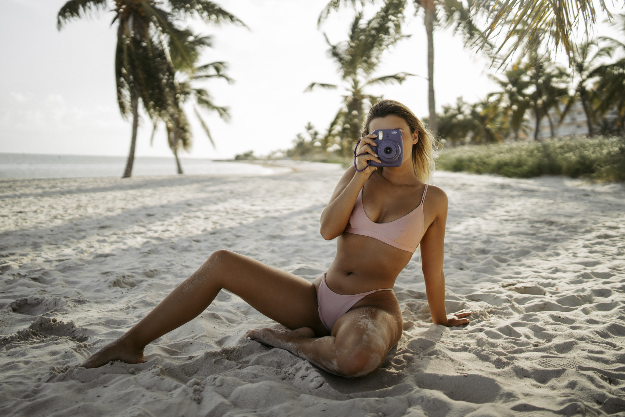People 2048x1366 women blonde palm trees tanned belly camera sand bikini sand covered sea sitting Faith Marone women outdoors tiptoe women on beach beach