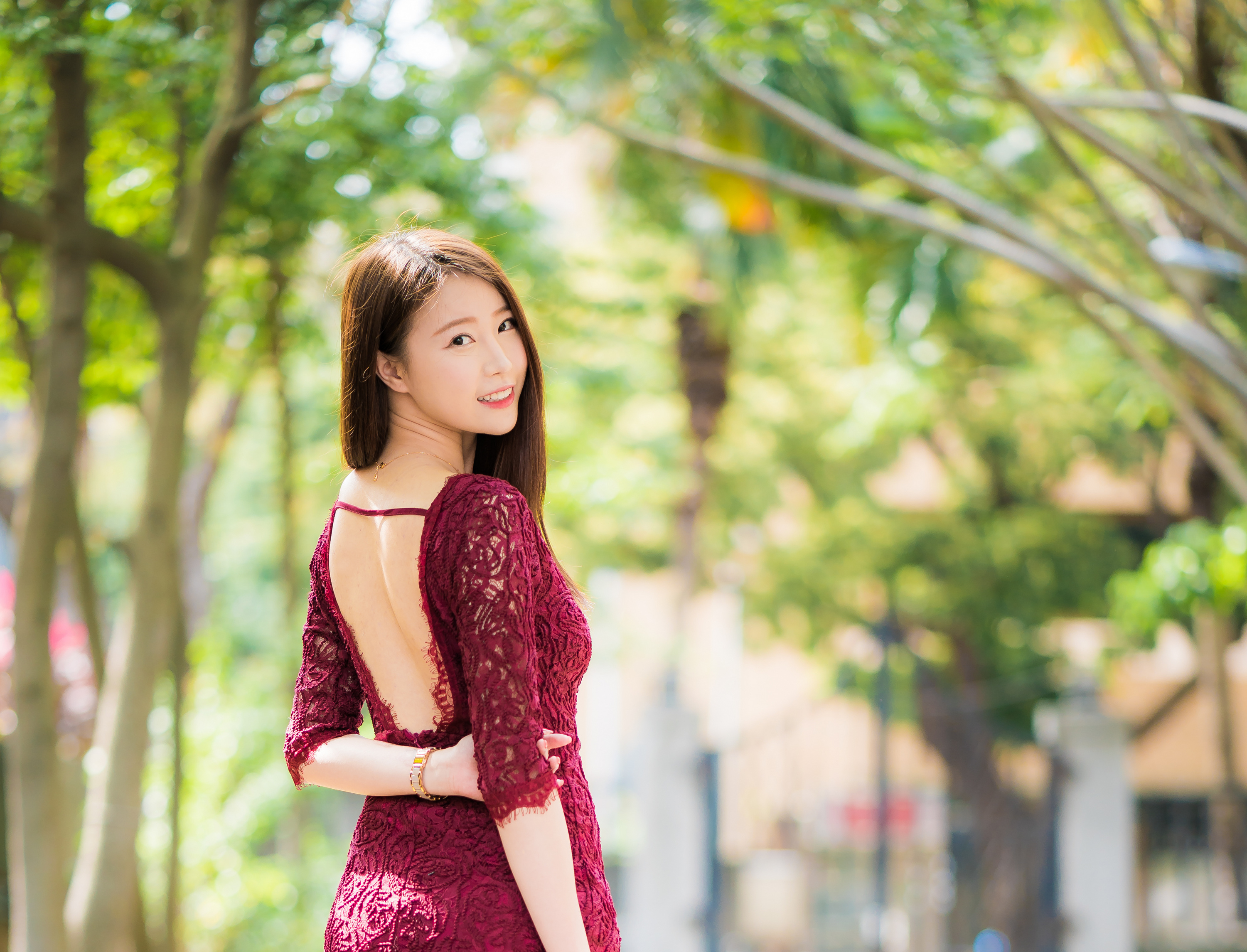 People 3001x2291 Asian model women long hair brunette depth of field necklace bracelets red dress looking at viewer trees house arm(s) behind back