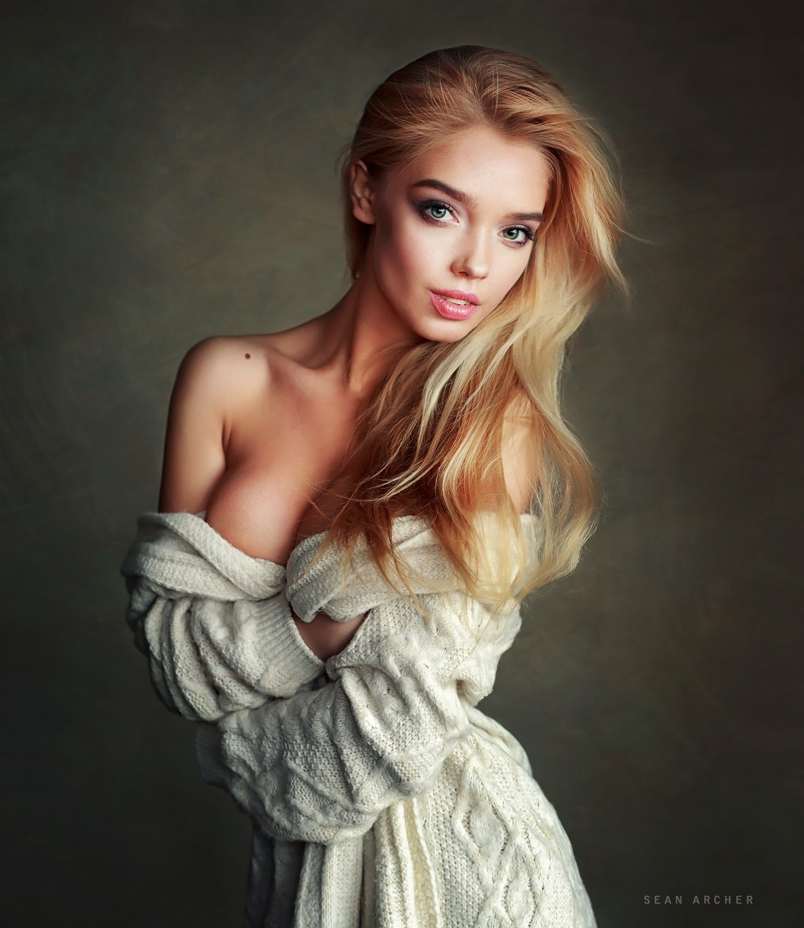 People 1646x1900 Sean Archer women Katya Kotaro blonde long hair green eyes makeup lipstick looking at viewer sweater open clothes holding clothes simple background studio women indoors indoors model cleavage no bra cleavage cutout knit fabric bare shoulders