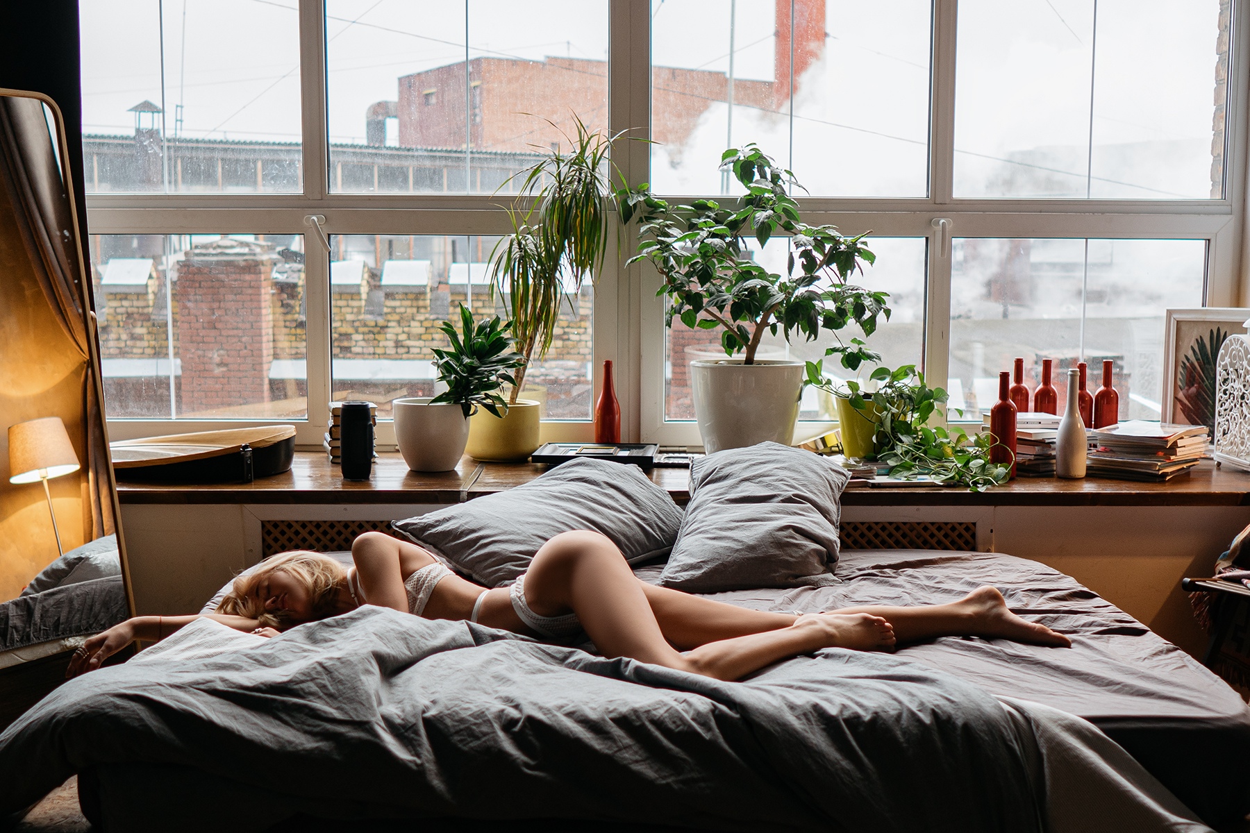 People 1800x1200 women blonde white lingerie plants in bed pillow window bottles mirror reflection lamp closed eyes ass brunette books fishnet Aleksey Trifonov pointed toes shoulder length hair bent legs lying on side natural light