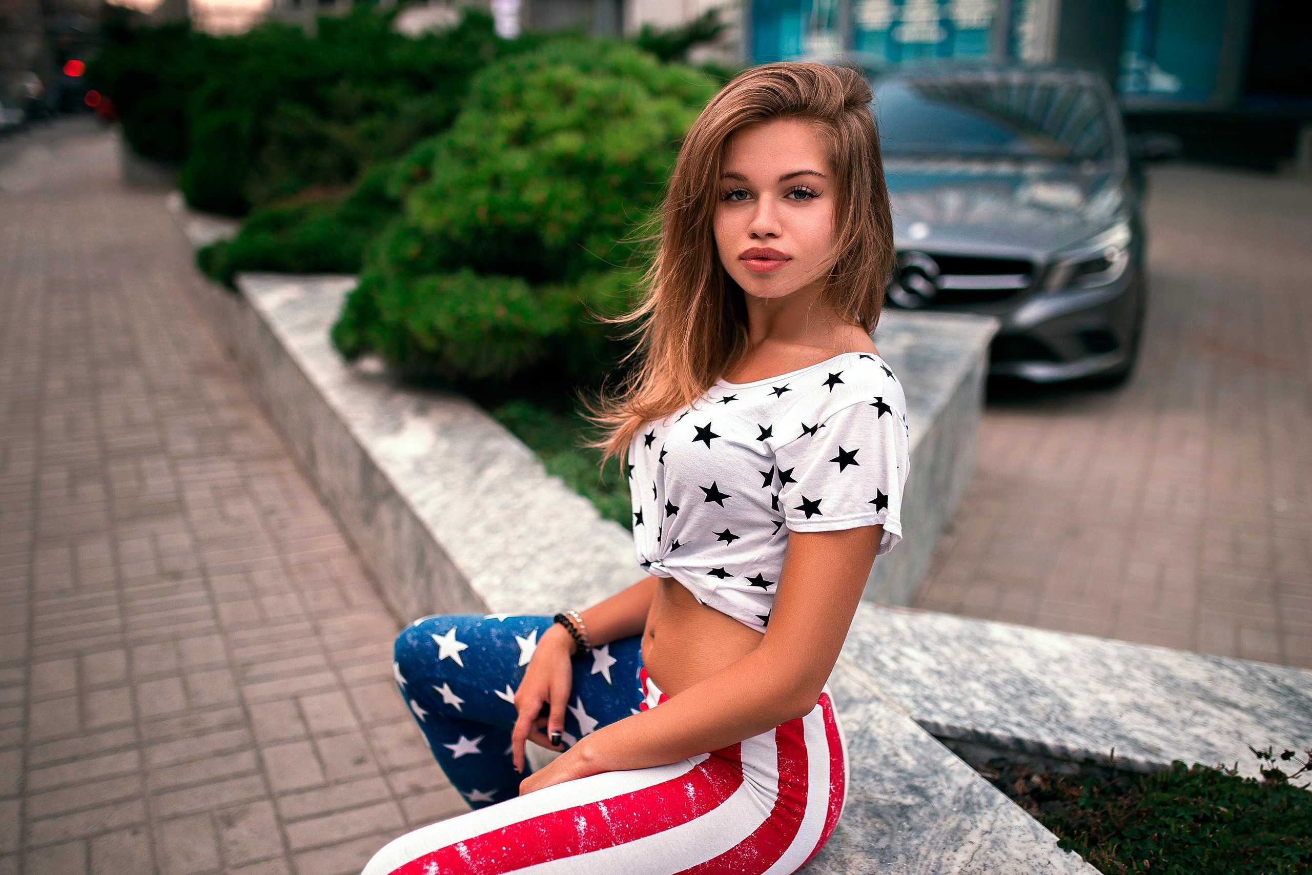People 2560x1707 women American flag model sitting Irina Petrenko-Novinskaya T-shirt fake lips women outdoors looking at viewer bare midriff urban car Mercedes-Benz outdoors