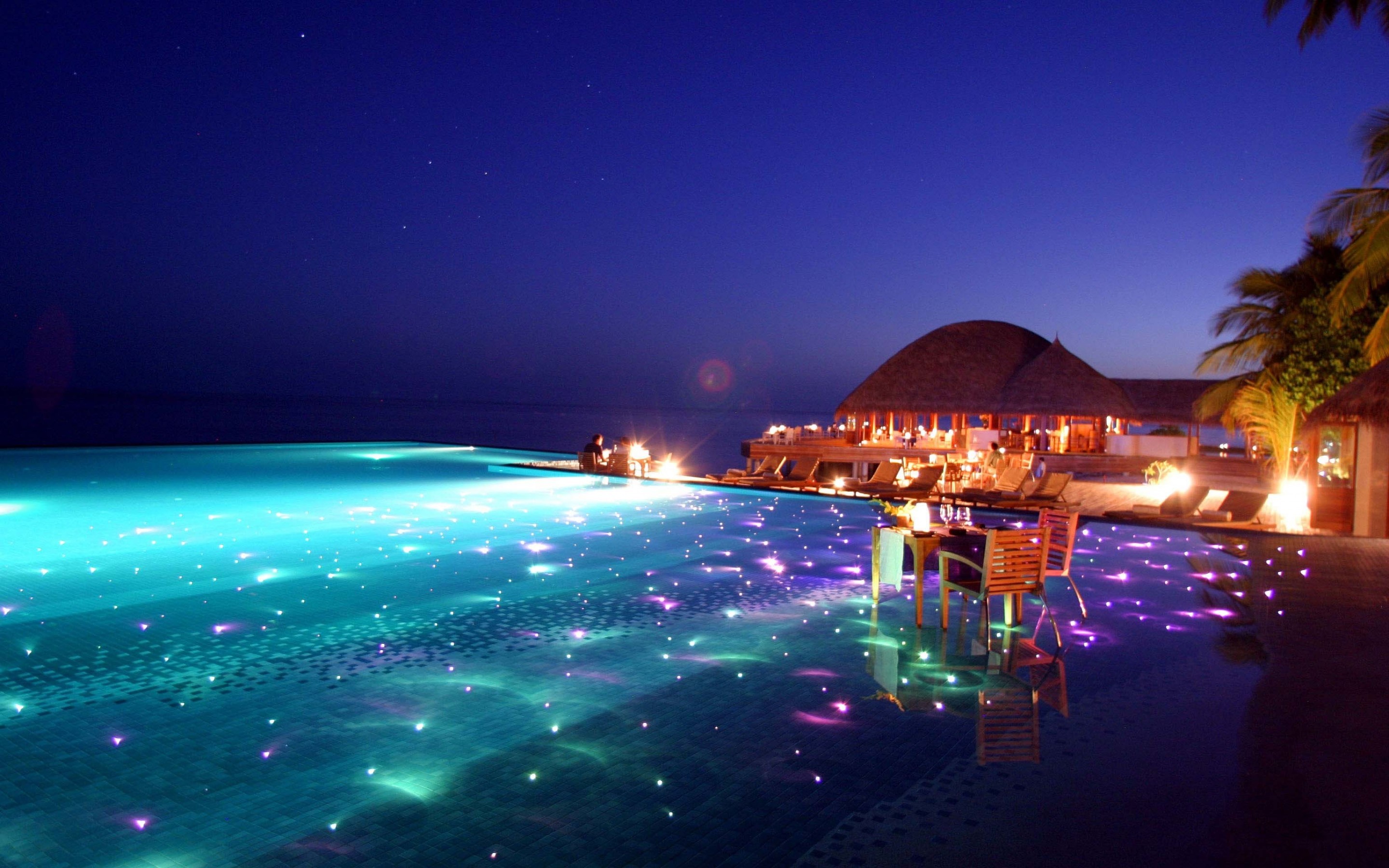 General 2880x1800 water beach sky Maldives glowing swimming pool hotel hut chair cyan evening
