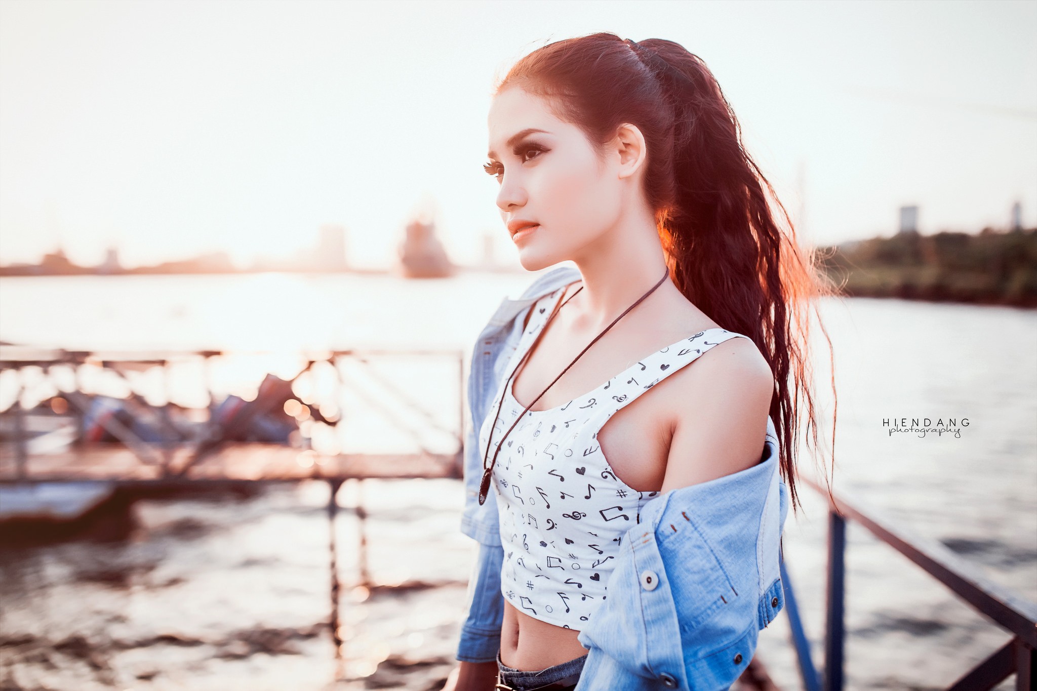 People 2048x1365 women Asian brunette camisole denim jacket ponytail profile looking into the distance Hien Dang women outdoors long hair watermarked water sunlight musical notes white tops belly