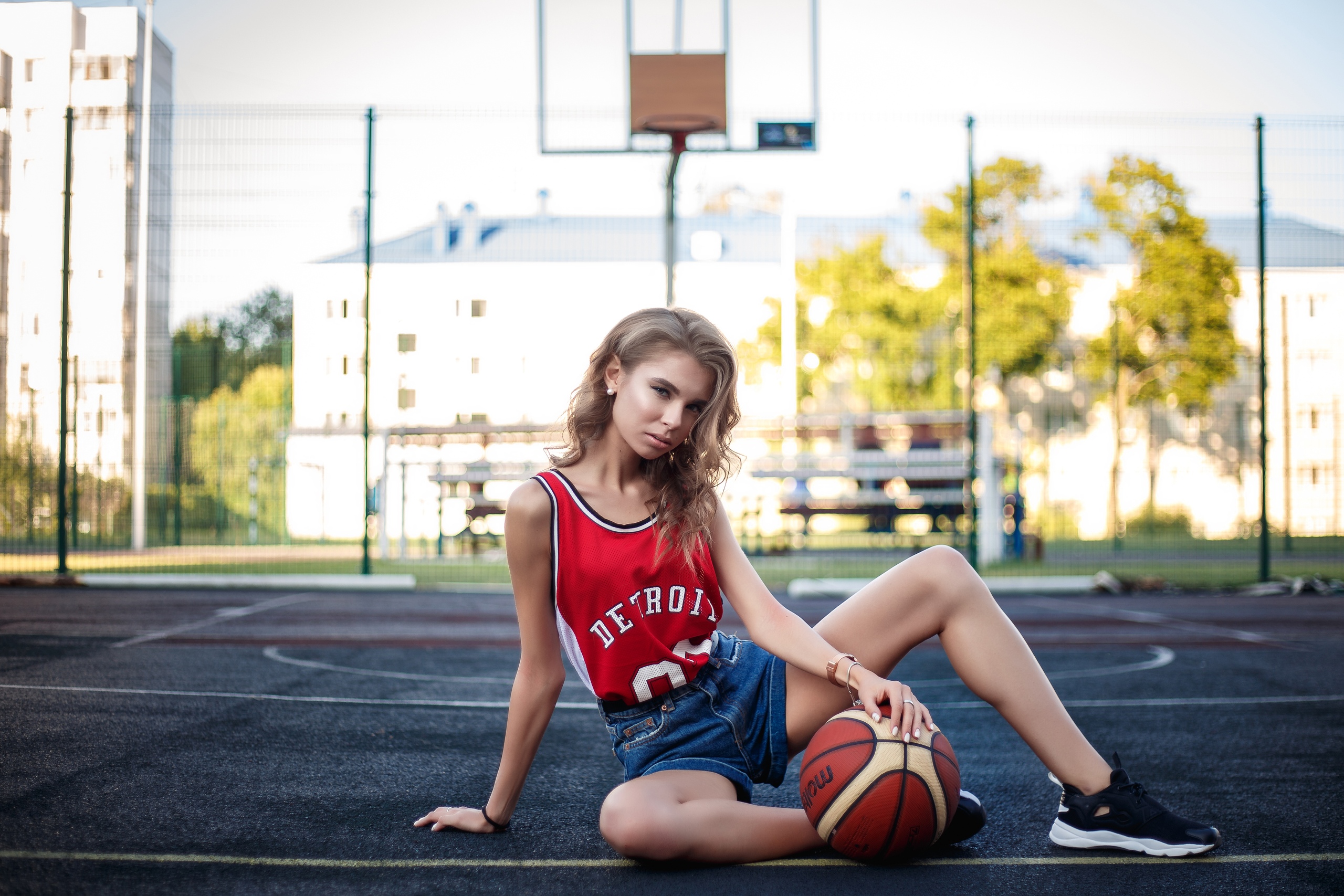 People 2560x1707 women model outdoors sports jerseys jean shorts on the floor basketball ball sneakers basketball court depth of field looking at viewer sitting women outdoors spread legs
