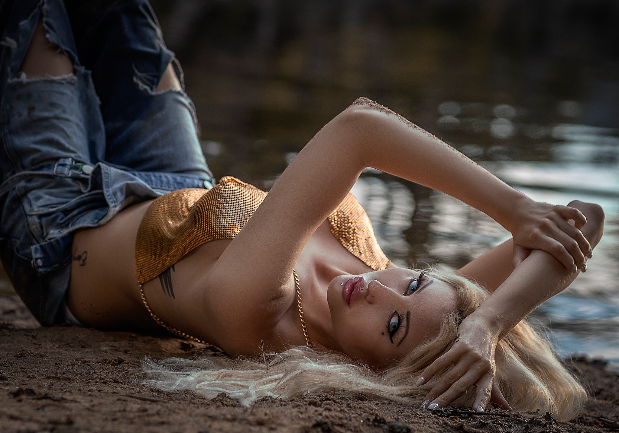 People 2048x1435 model women blonde blue eyes top jeans torn jeans tattoo arms up bare shoulders lips lipstick juicy lips lying on back looking at viewer women outdoors