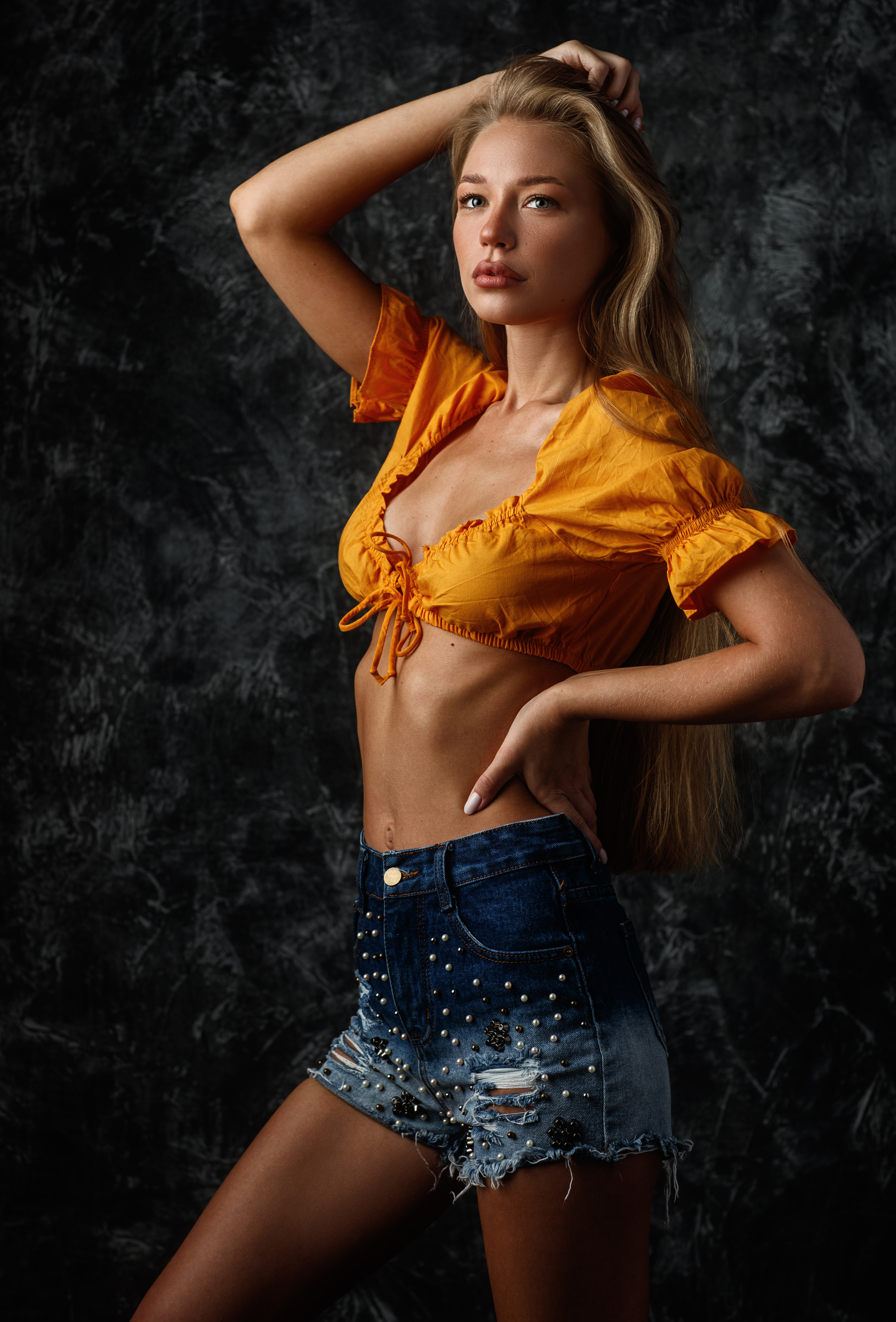 People 2372x3500 Sergey Sorokin women blonde long hair knot shorts denim simple background orange tops