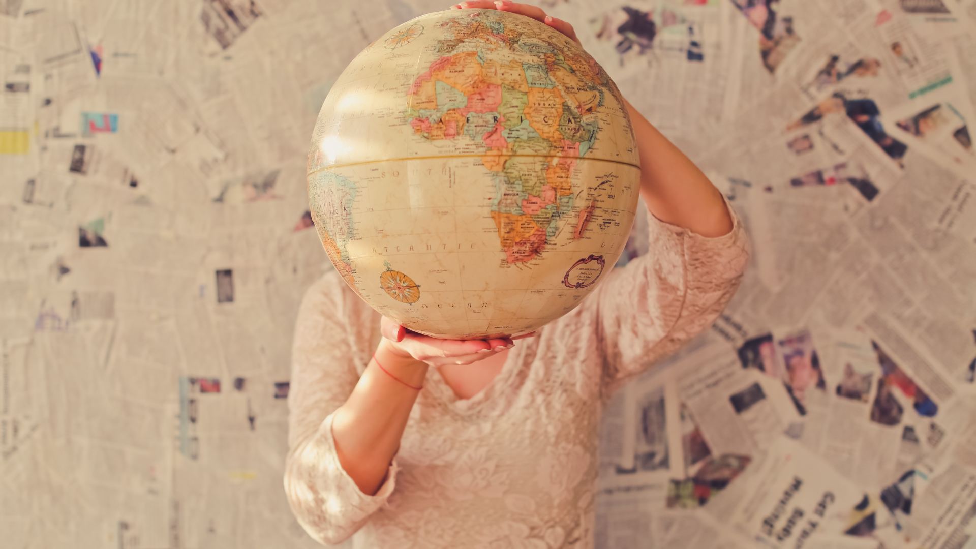 General 1920x1080 globes continents map countries women depth of field newspapers hands Africa wall frontal view beige