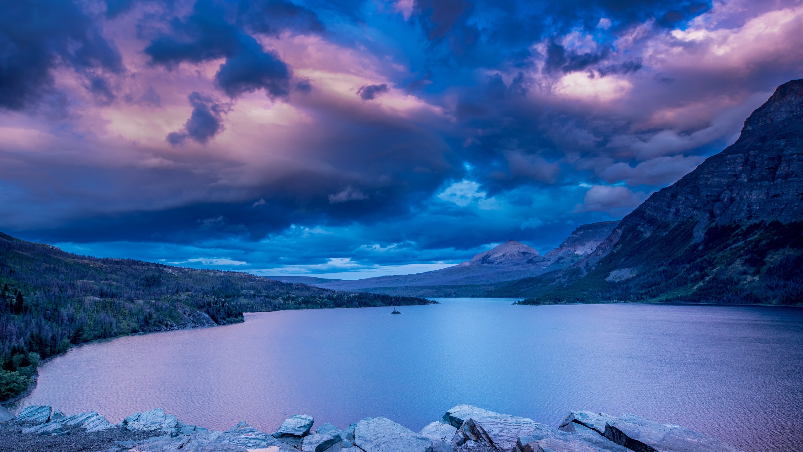 General 2560x1440 Rocky Mountains sky colorful nature lake water landscape Glacier National Park purple rugged terrain
