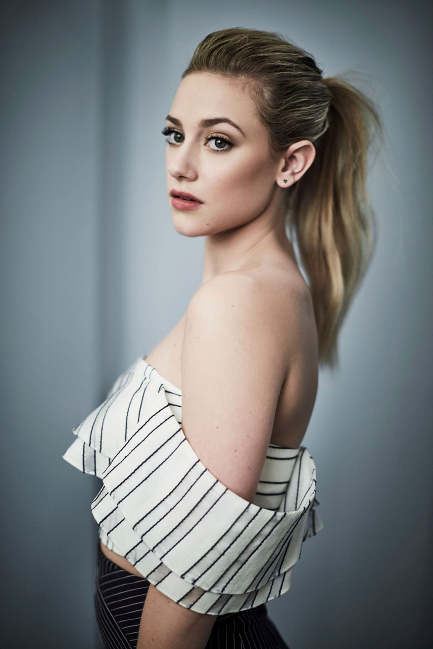 People 853x1280 Lili Reinhart women actress blonde ponytail simple background bare shoulders face women indoors
