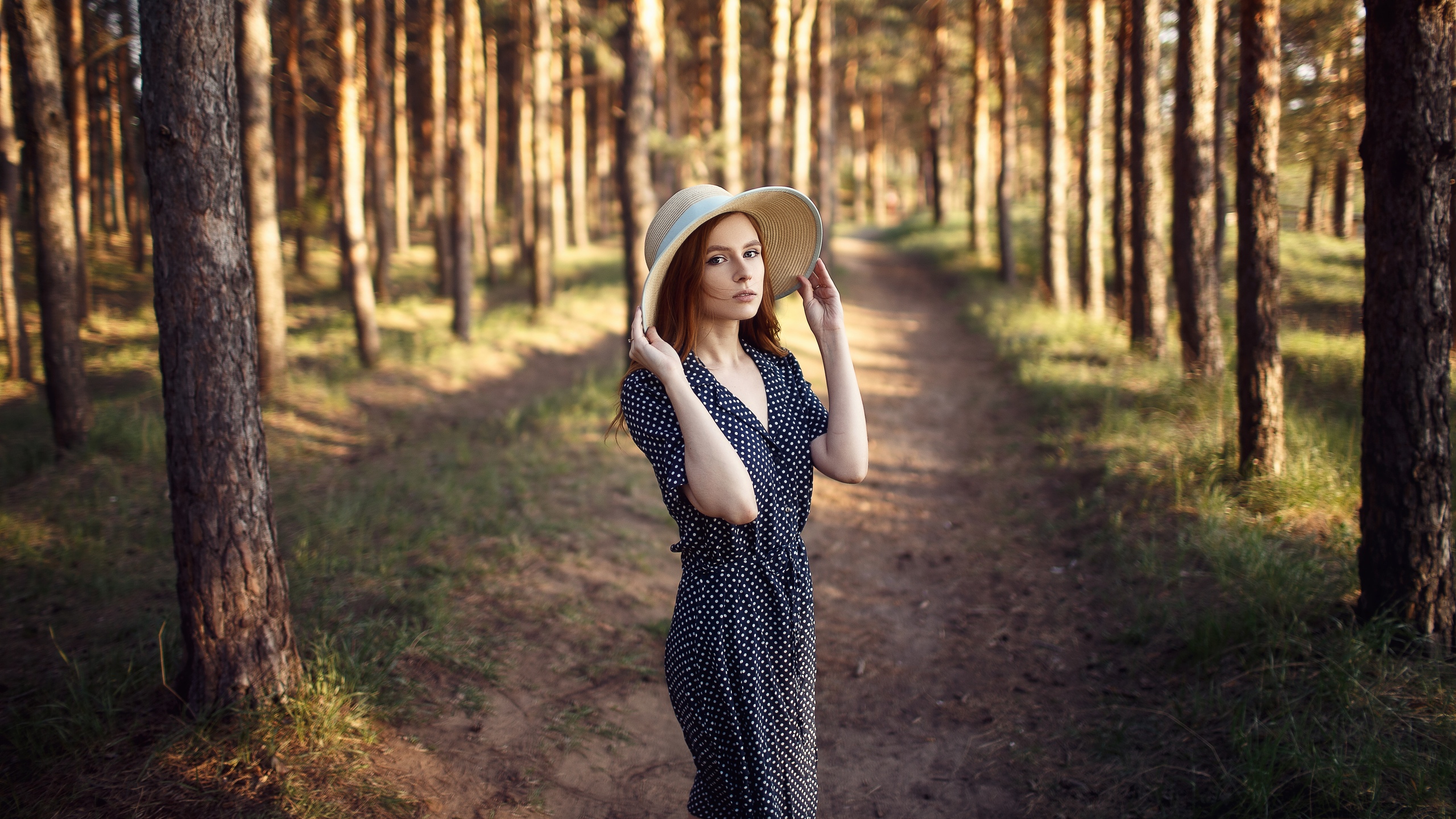 People 2560x1440 women model brunette portrait hat women with hats dress polka dots depth of field forest trees outdoors women outdoors looking at viewer cleavage photography