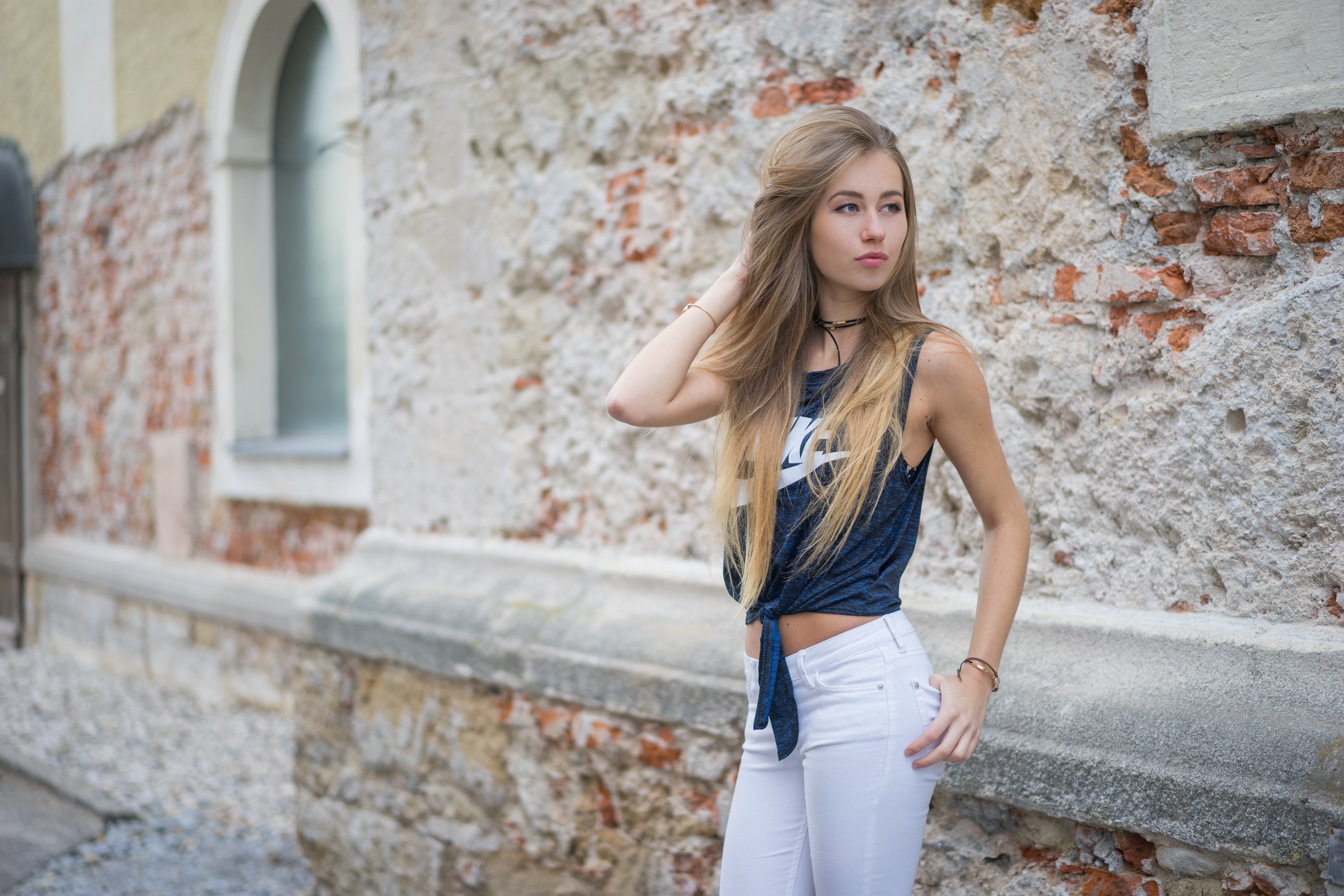 People 6000x4000 blonde blue eyes hand(s) in hair jeans white clothing Nike looking into the distance women white  pants light pants