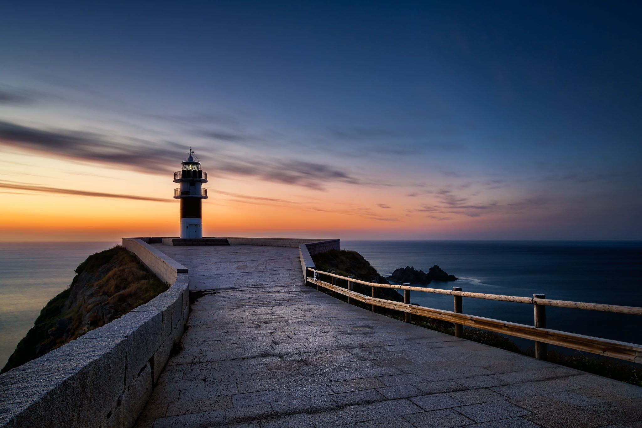 General 2048x1365 lighthouse sky blue sea calm sunset pavements dusk