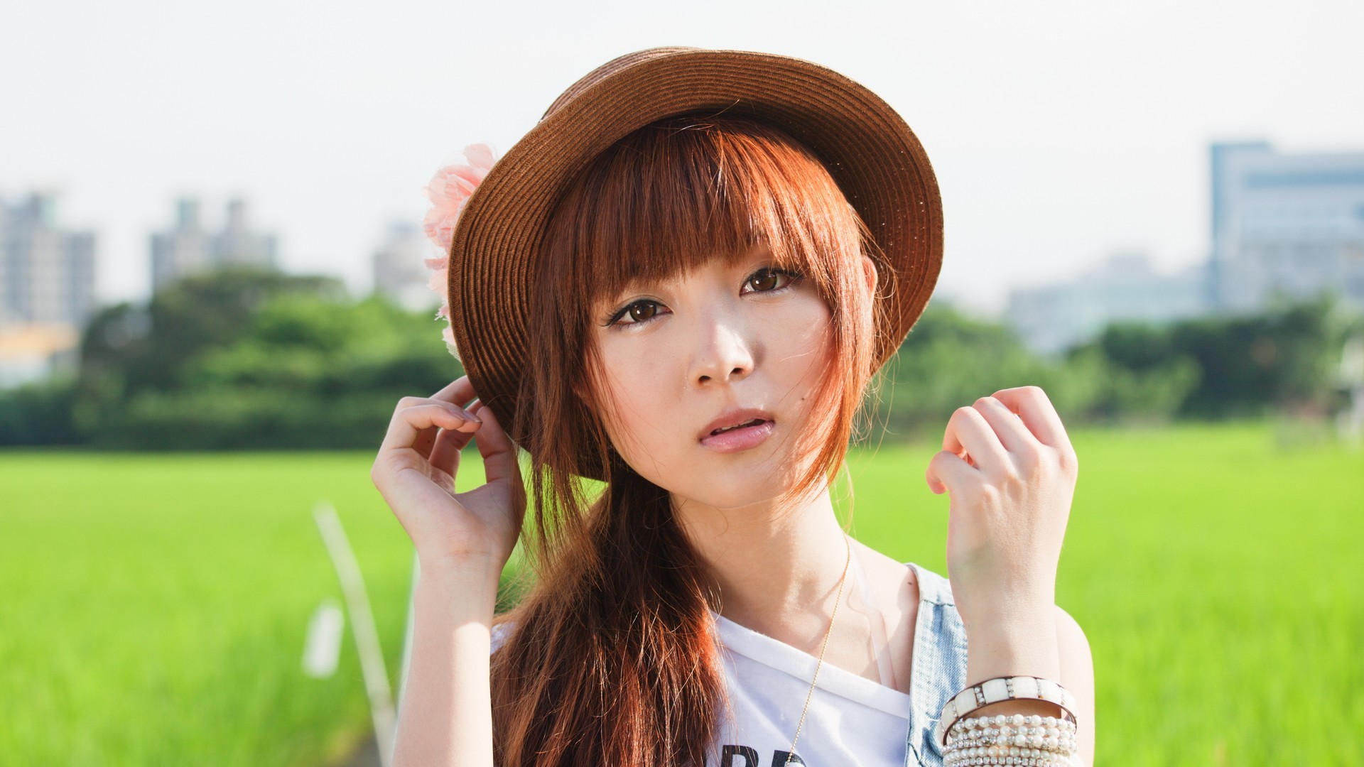 People 1920x1080 women model Asian redhead hat millinery brown eyes outdoors looking at viewer bare shoulders