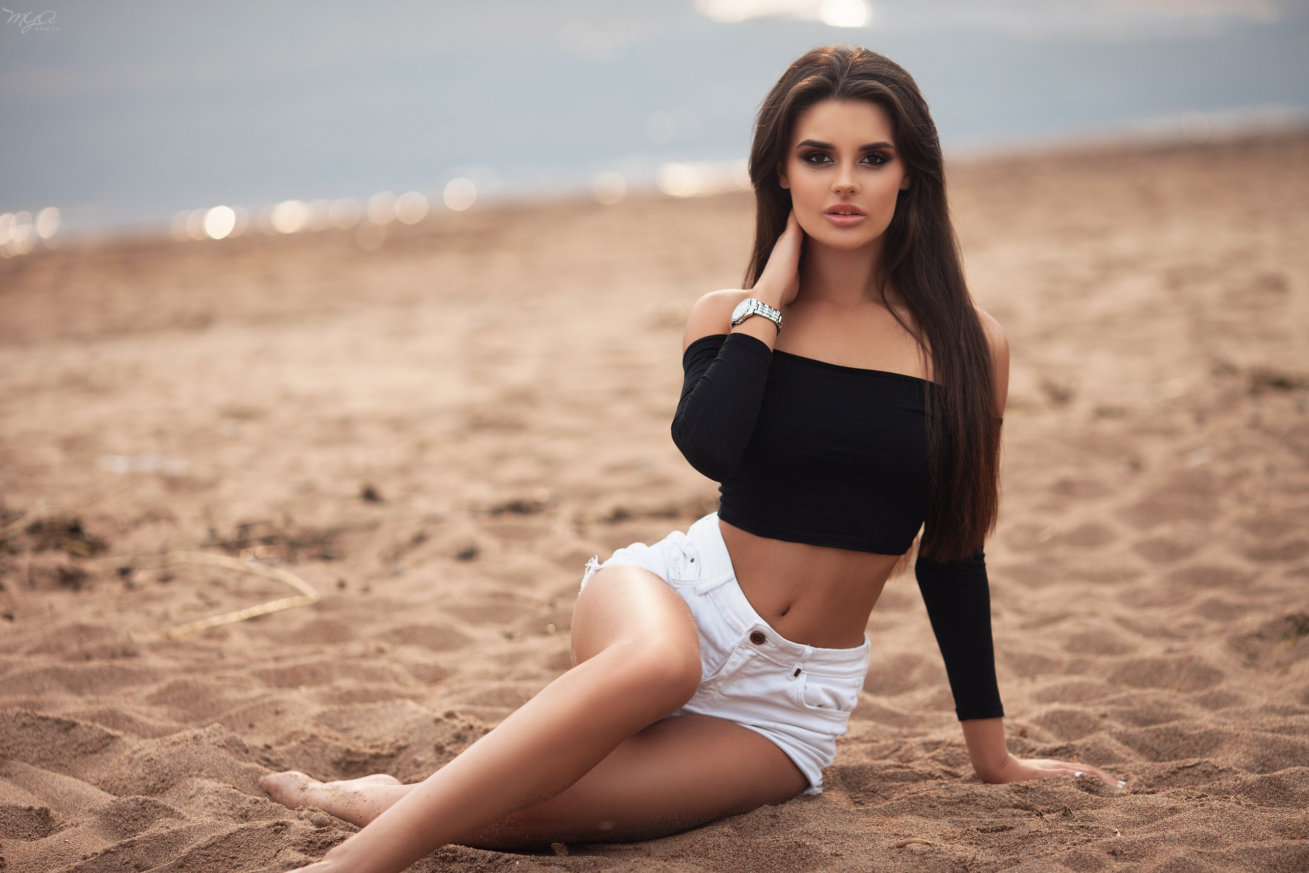 People 2560x1707 women sand belly depth of field tanned sitting long hair jean shorts women outdoors portrait beach sand covered looking at viewer