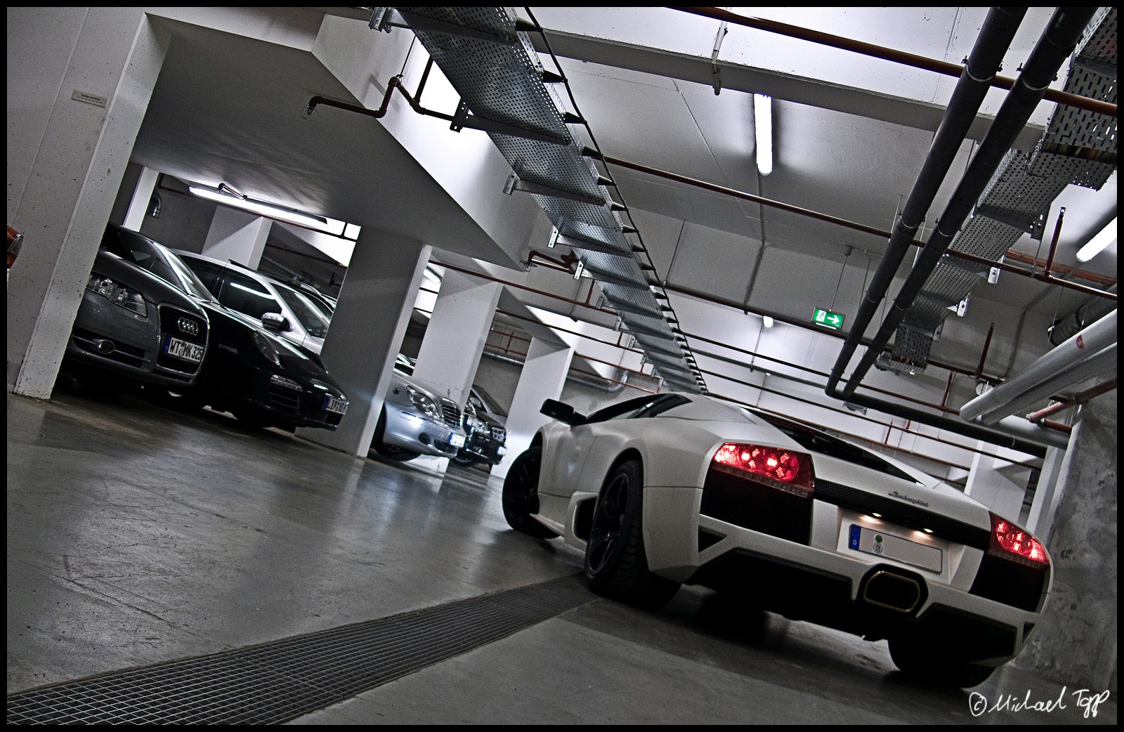 General 1600x1042 car vehicle white cars Lamborghini parking garage Lamborghini Murcielago italian cars Volkswagen Group