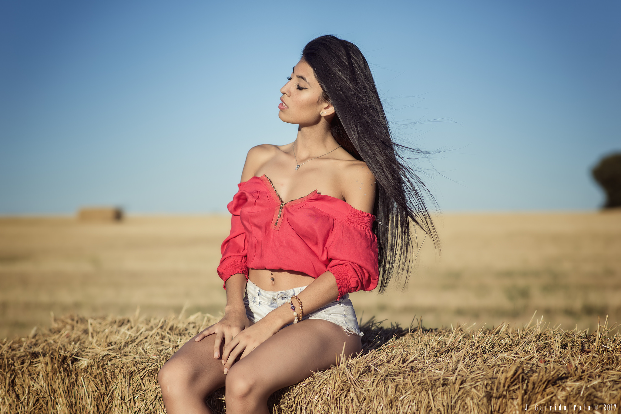 People 2048x1367 women jean shorts sitting women outdoors sky tanned belly pierced navel necklace bare shoulders hay long hair