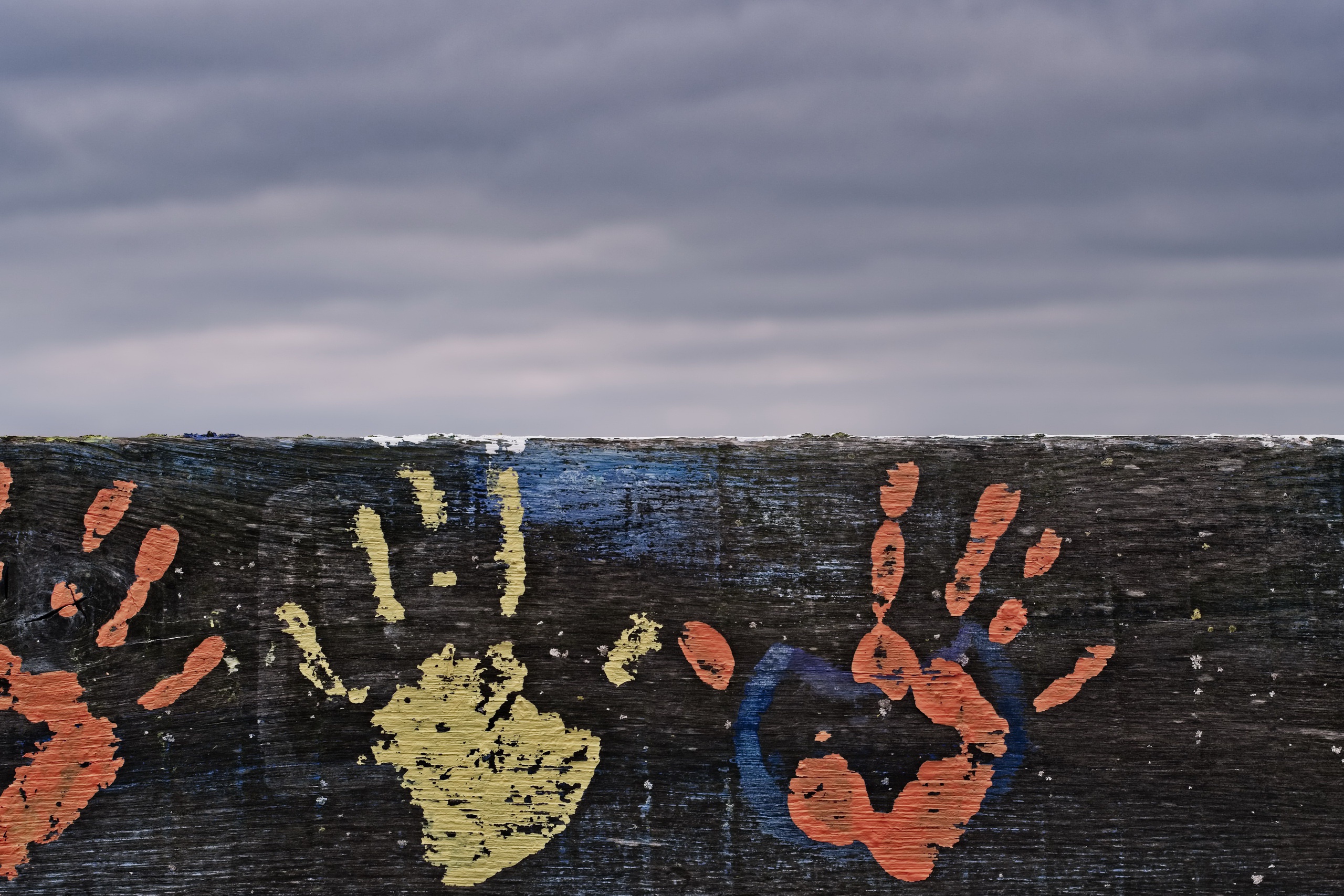 General 2560x1707 wall handprints sky closeup