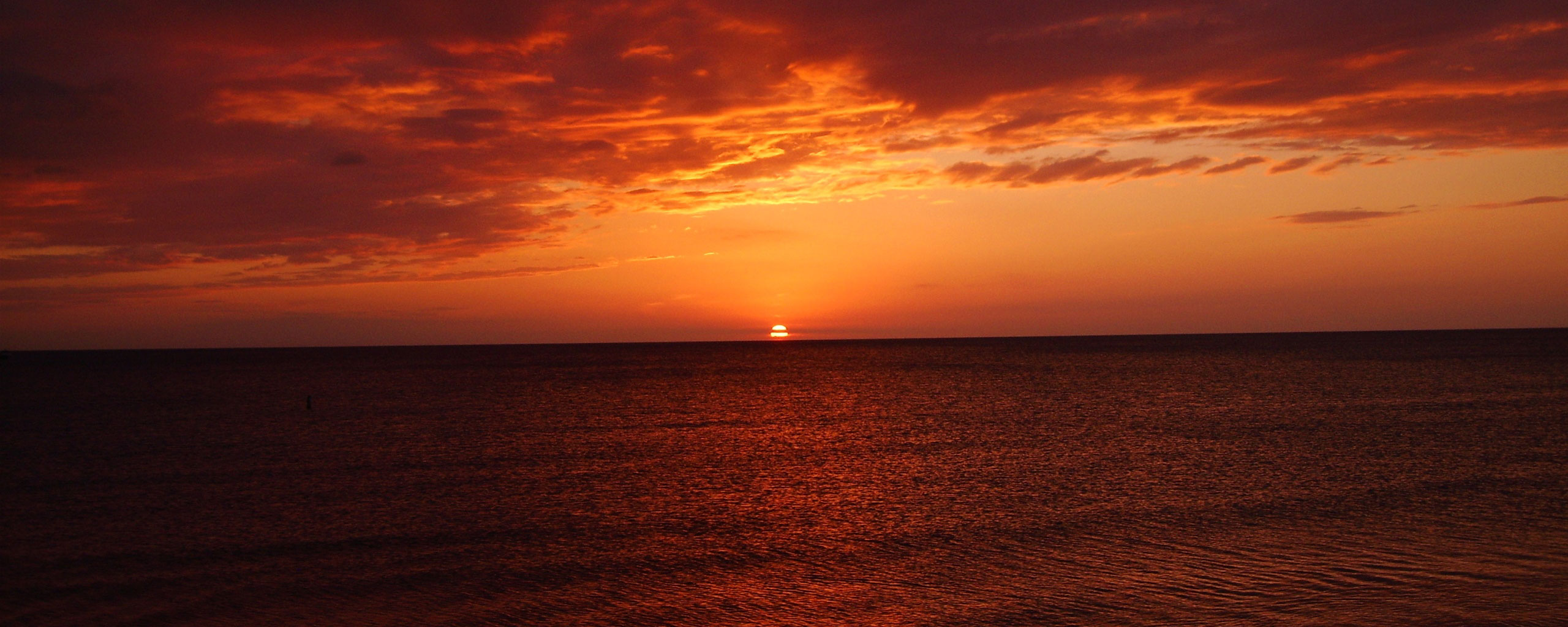 General 2560x1024 wide screen sunset sea horizon sky clouds sunlight panorama