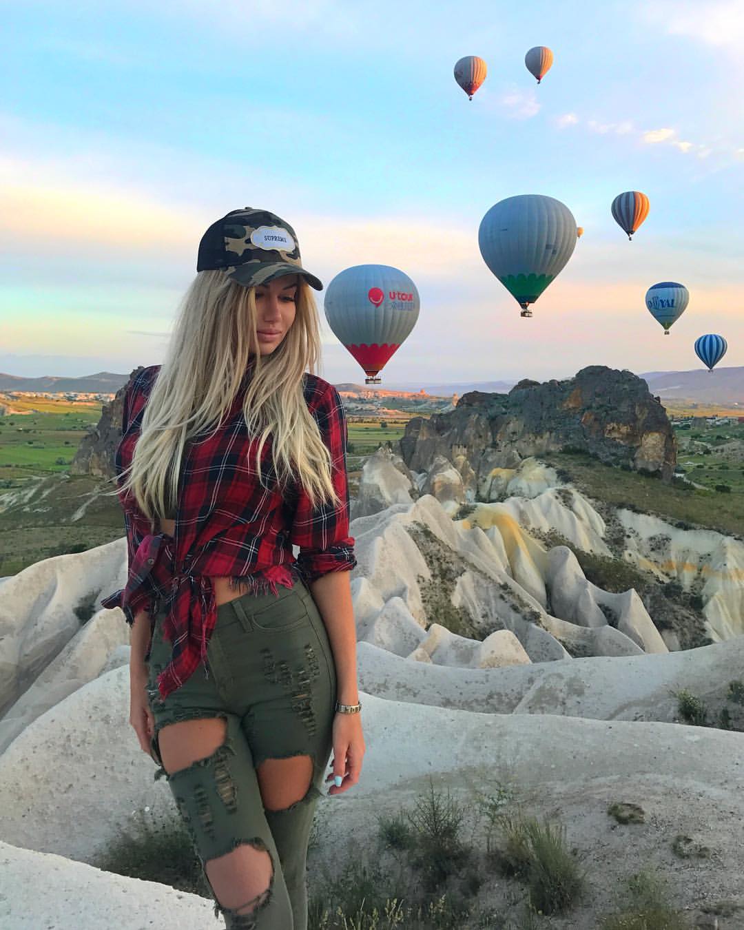 People 1080x1350 Anyuta Chernova photography women women outdoors Russian women Russian model model blonde face closed eyes sky clouds jeans hot air balloons mountains hat torn clothes