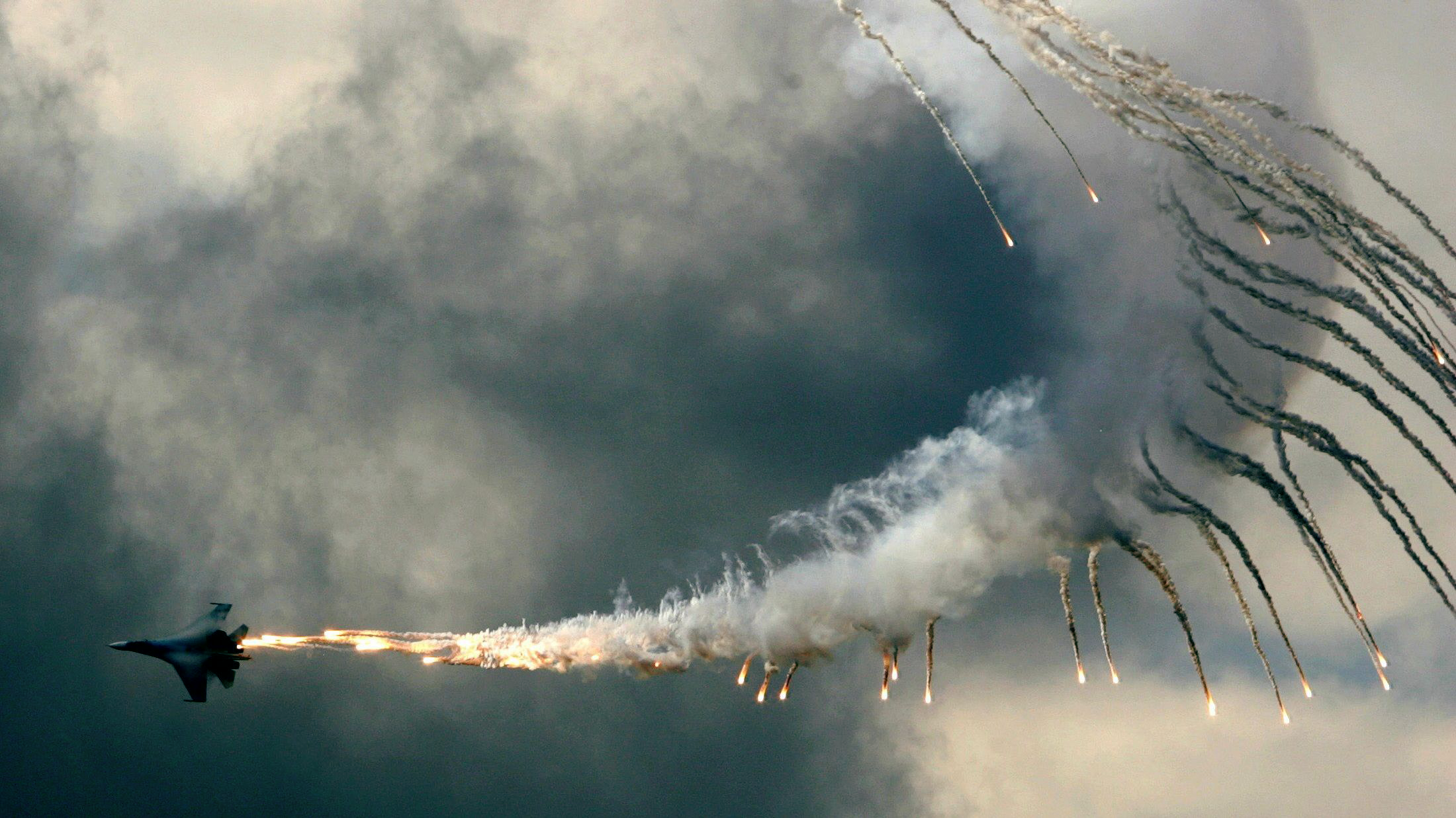General 2200x1237 smoke sky clouds fire Sukhoi Su-27 flares jet fighter military Sukhoi Russian/Soviet aircraft