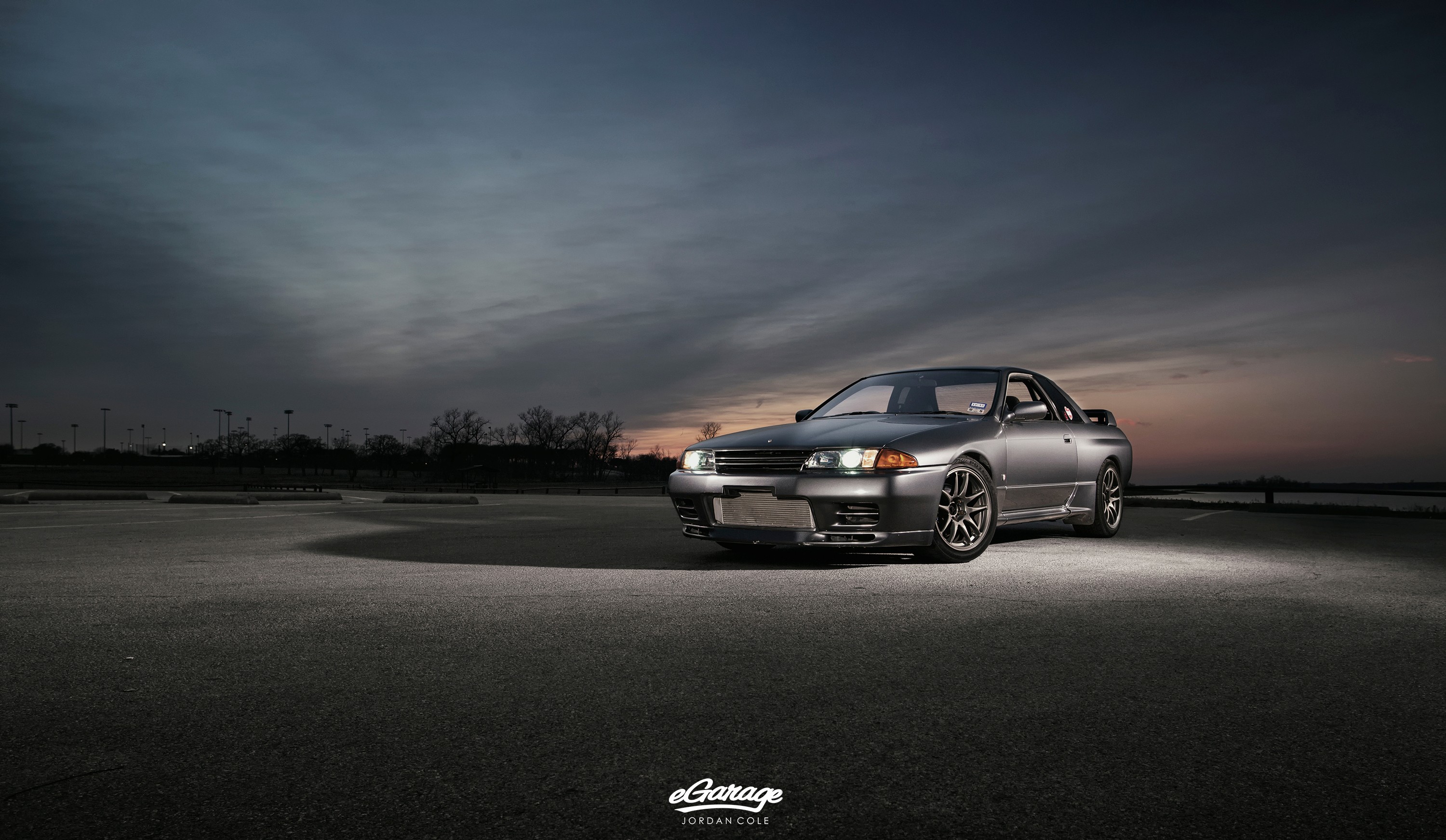 General 3000x1745 car vehicle Nissan black cars Nissan Skyline Japanese cars clouds frontal view headlights sky watermarked