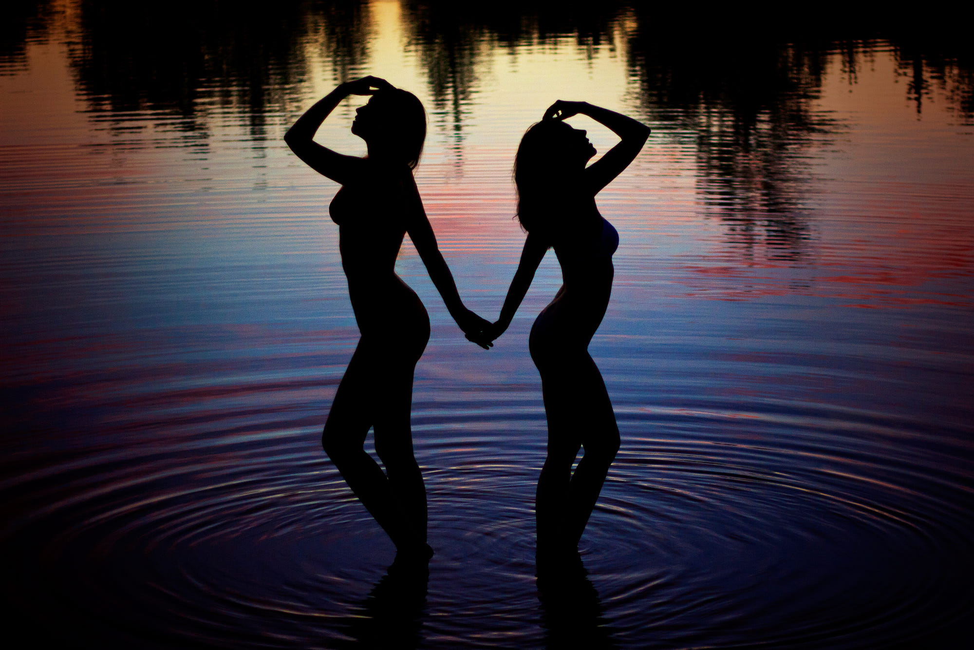 People 2000x1334 women women outdoors water holding hands sunset reflection waves shadow Melanie Dietze silhouette two women nude nature in water standing low light