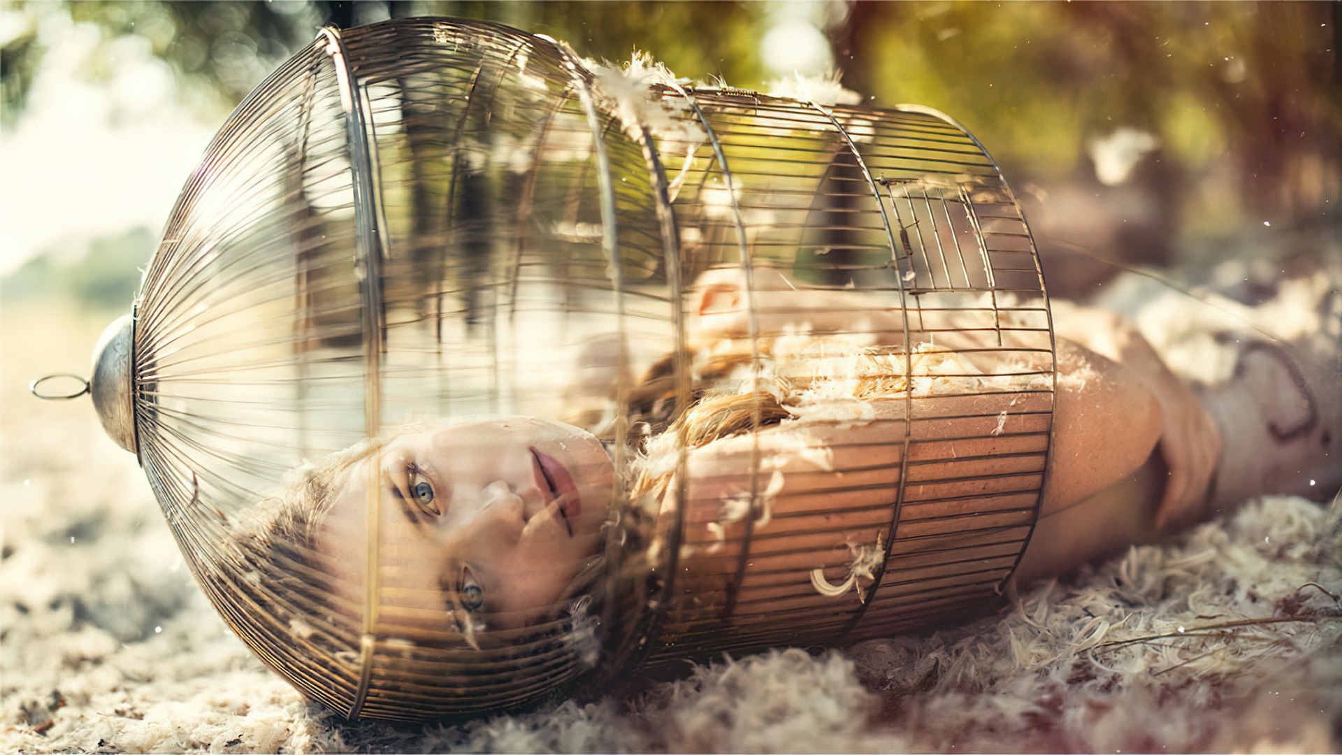 People 1920x1080 cages feathers outdoors women outdoors blue eyes women looking at viewer blonde lying down model