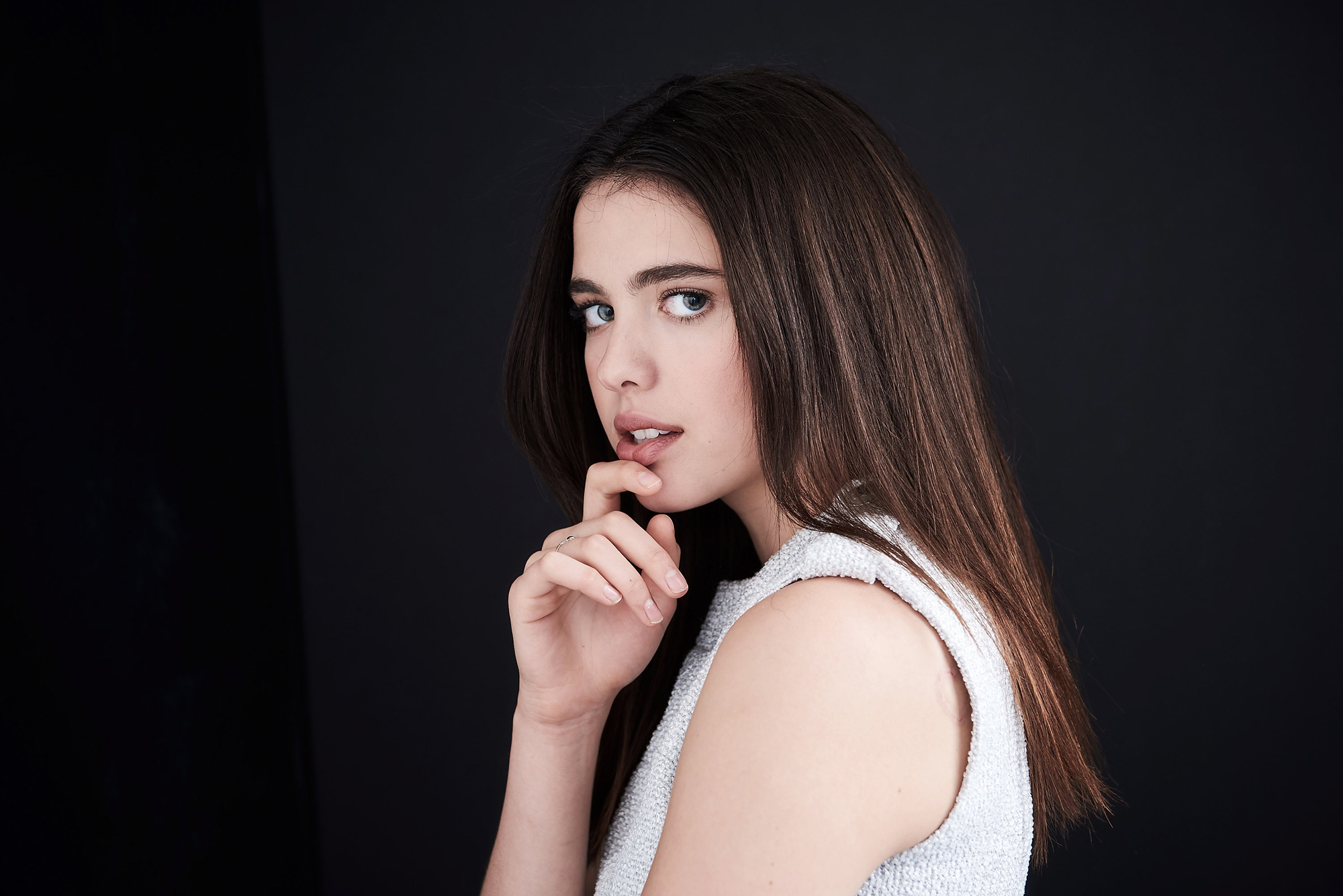 People 2000x1335 Margaret Qualley women actress brunette simple background long hair dark hair dark background looking at viewer young women finger on lips gray eyes straight hair open mouth