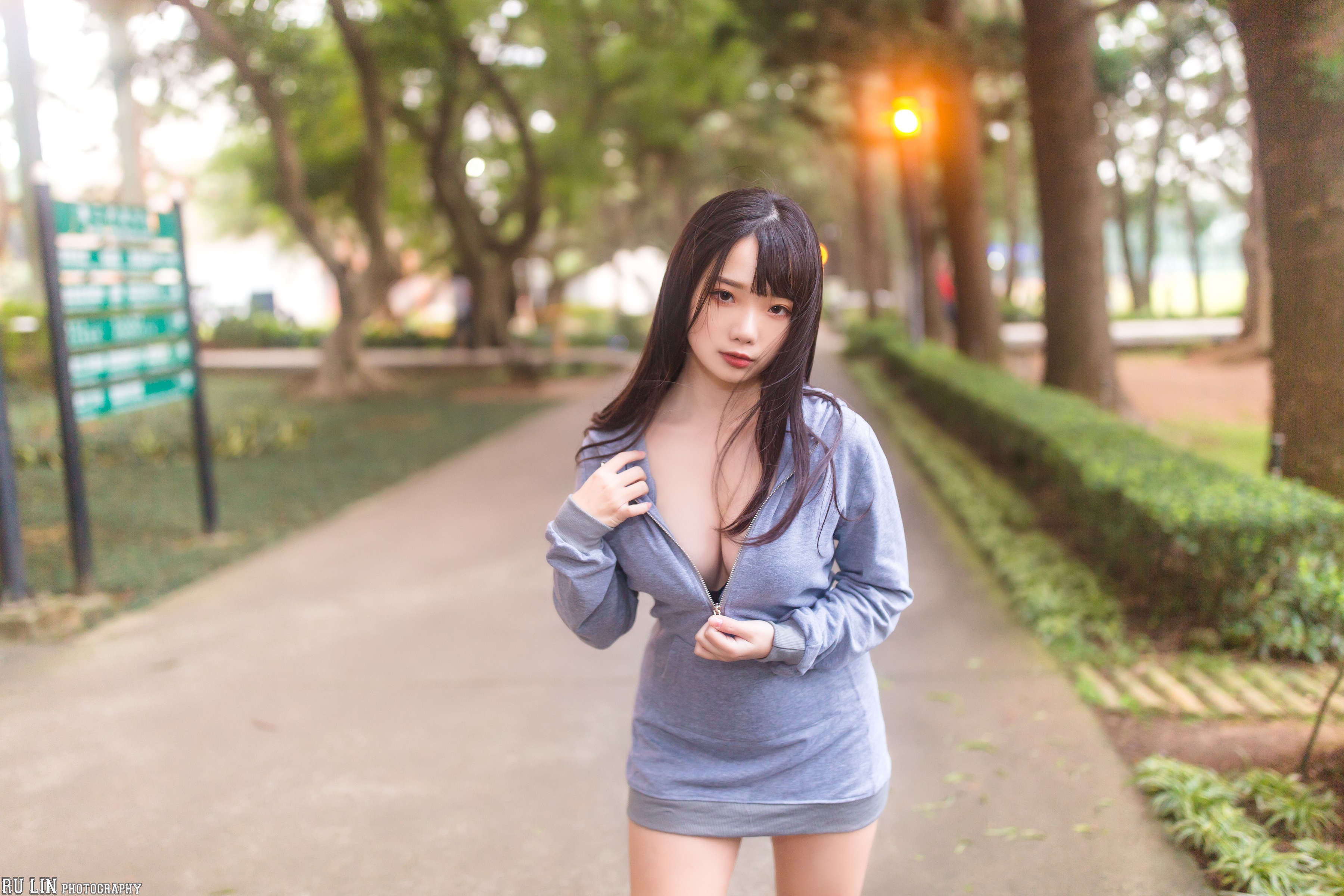 People 3600x2400 Ning Shioulin women model Asian brunette long hair looking at viewer brown eyes portrait frontal view depth of field dress cleavage grey clothing zipper bushes outdoors women outdoors trees