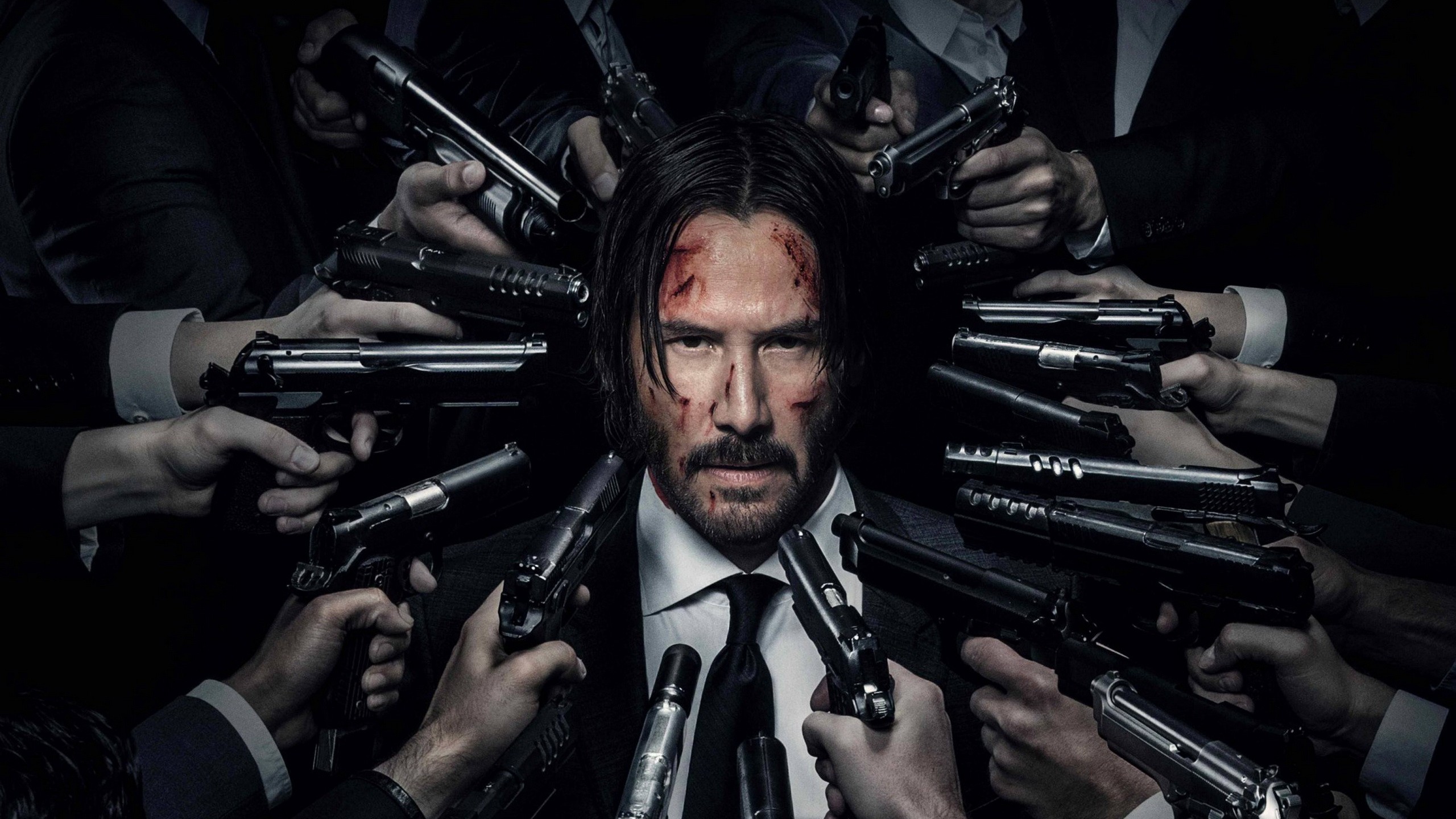 People 2560x1440 Keanu Reeves John Wick  gun movies actor beard blood surrounded men