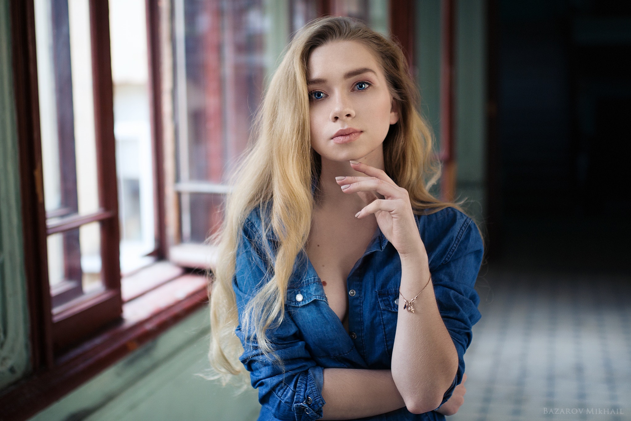 People 2048x1366 women blonde portrait denim shirt blue eyes depth of field Mikhail Bazarov touching face women indoors looking at viewer Alyona Streltsova solo closed mouth pink lipstick one arm up blue shirt shirt sideboob painted nails open shirt watermarked