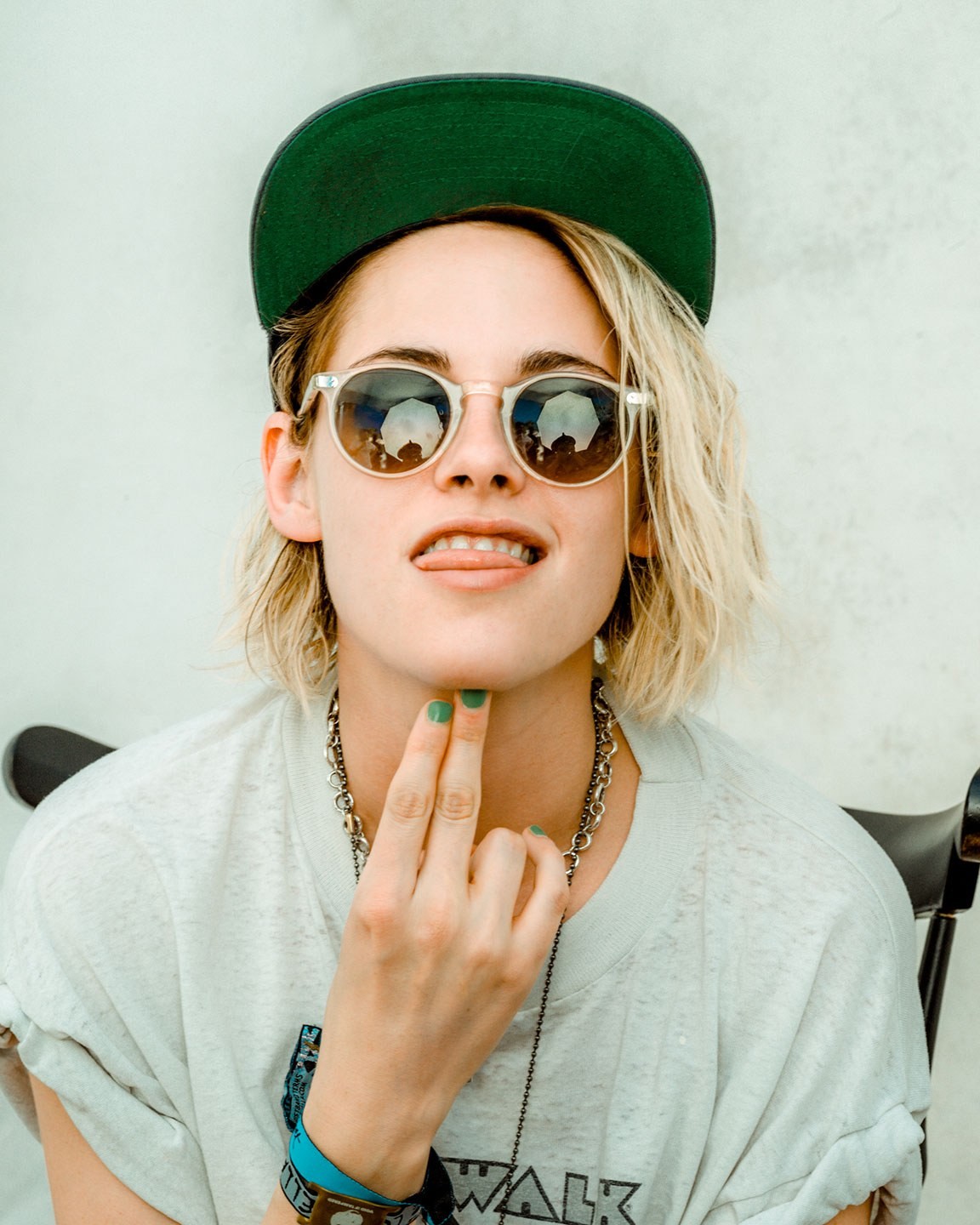 People 1152x1440 Kristen Stewart women actress looking at viewer American women tongues green nails sunglasses women with shades hat women with hats printed shirts parted lips blonde women indoors