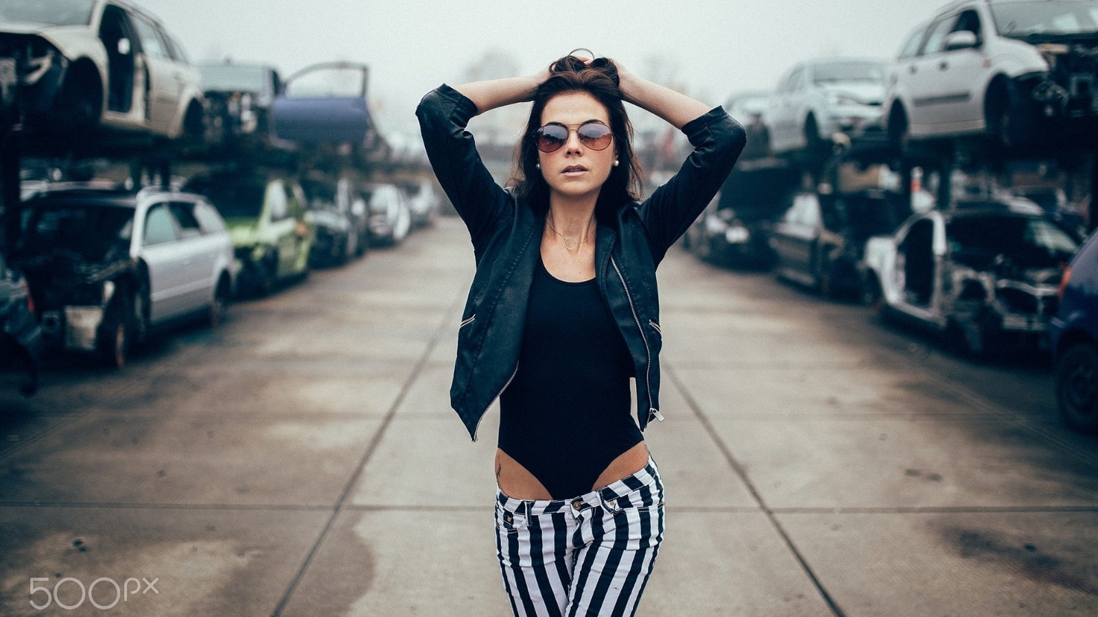 People 1600x900 women women with glasses arms up model wreck 500px women with shades sunglasses women with cars car vehicle bodysuit striped clothing women outdoors brunette junkyard