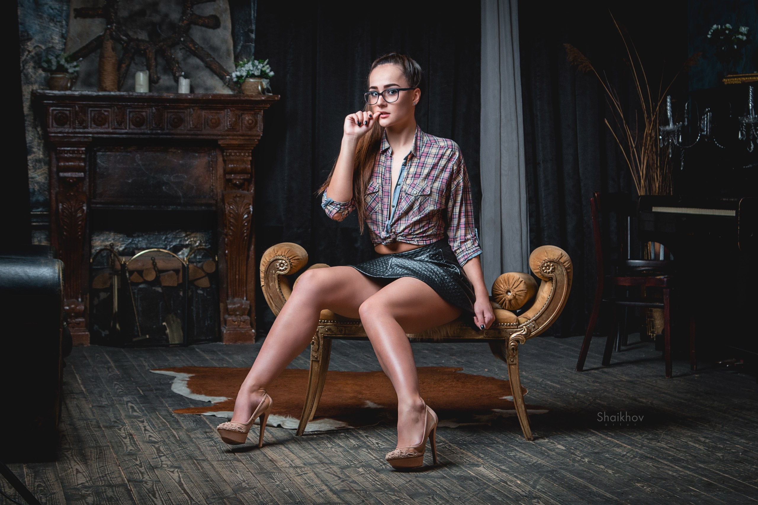 People 2560x1706 women sitting skirt shirt glasses high heels women with glasses wooden surface portrait finger on lips painted nails heels