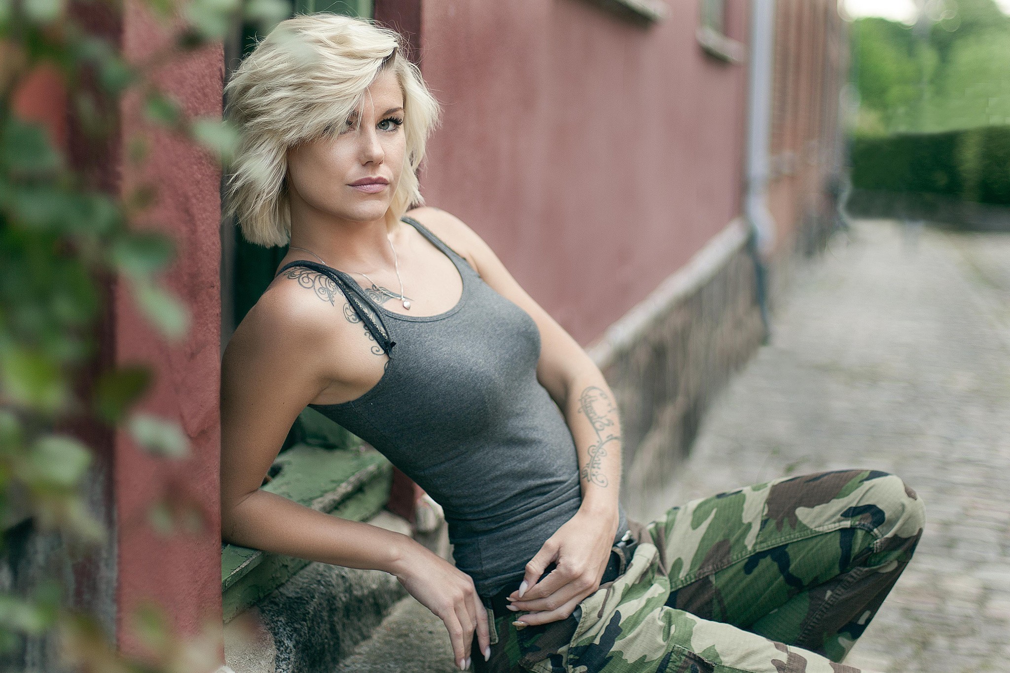 People 2048x1365 women blonde face short hair tattoo tank top portrait women outdoors cargo pants hair in face camouflage inked girls looking at viewer Reno Hansen