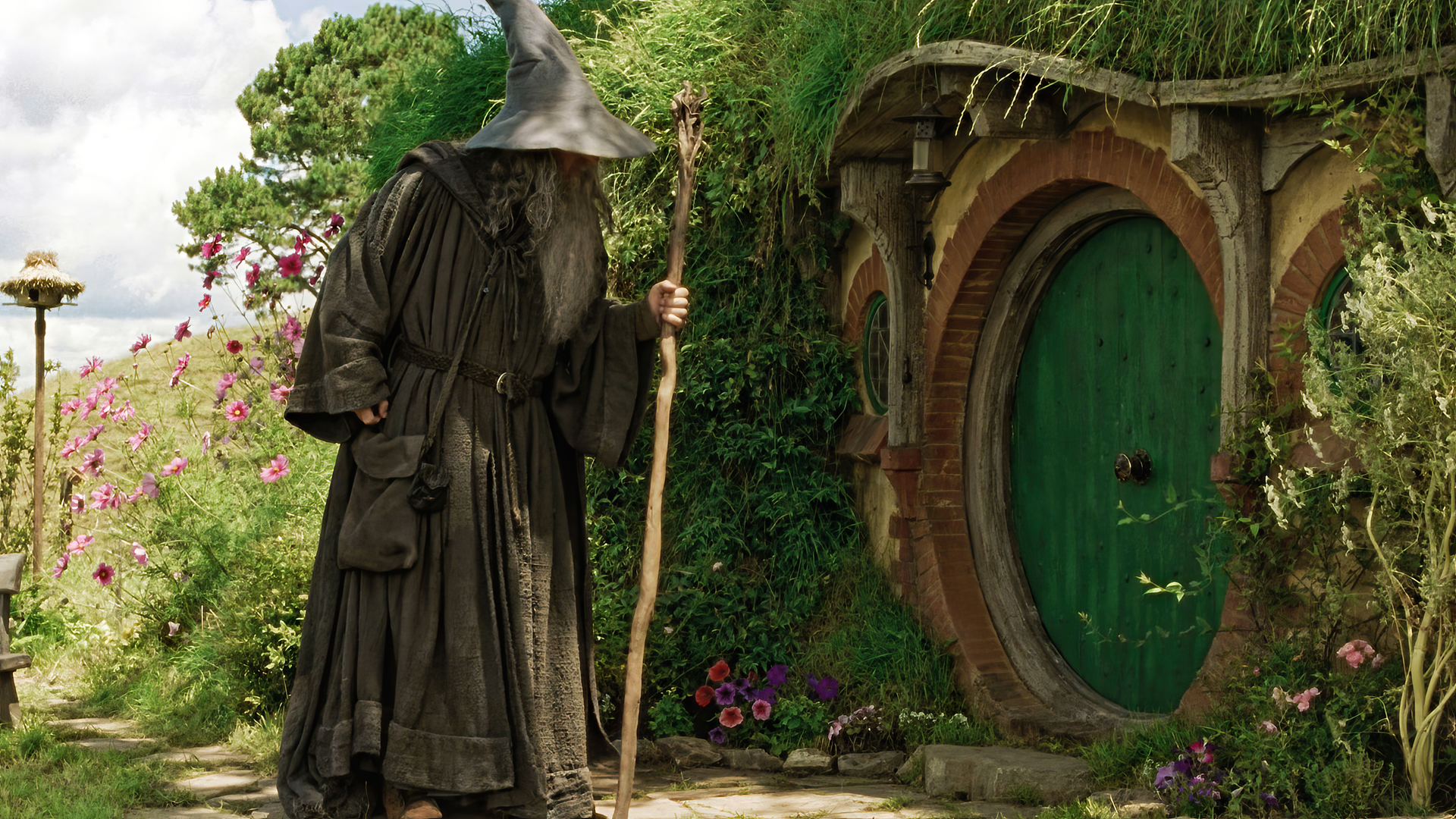 People 1920x1080 The Lord of the Rings: The Fellowship of the Ring Gandalf movies film stills Ian McKellen door The Shire wizard's hat staff Bag End house plants wizard flowers J. R. R. Tolkien