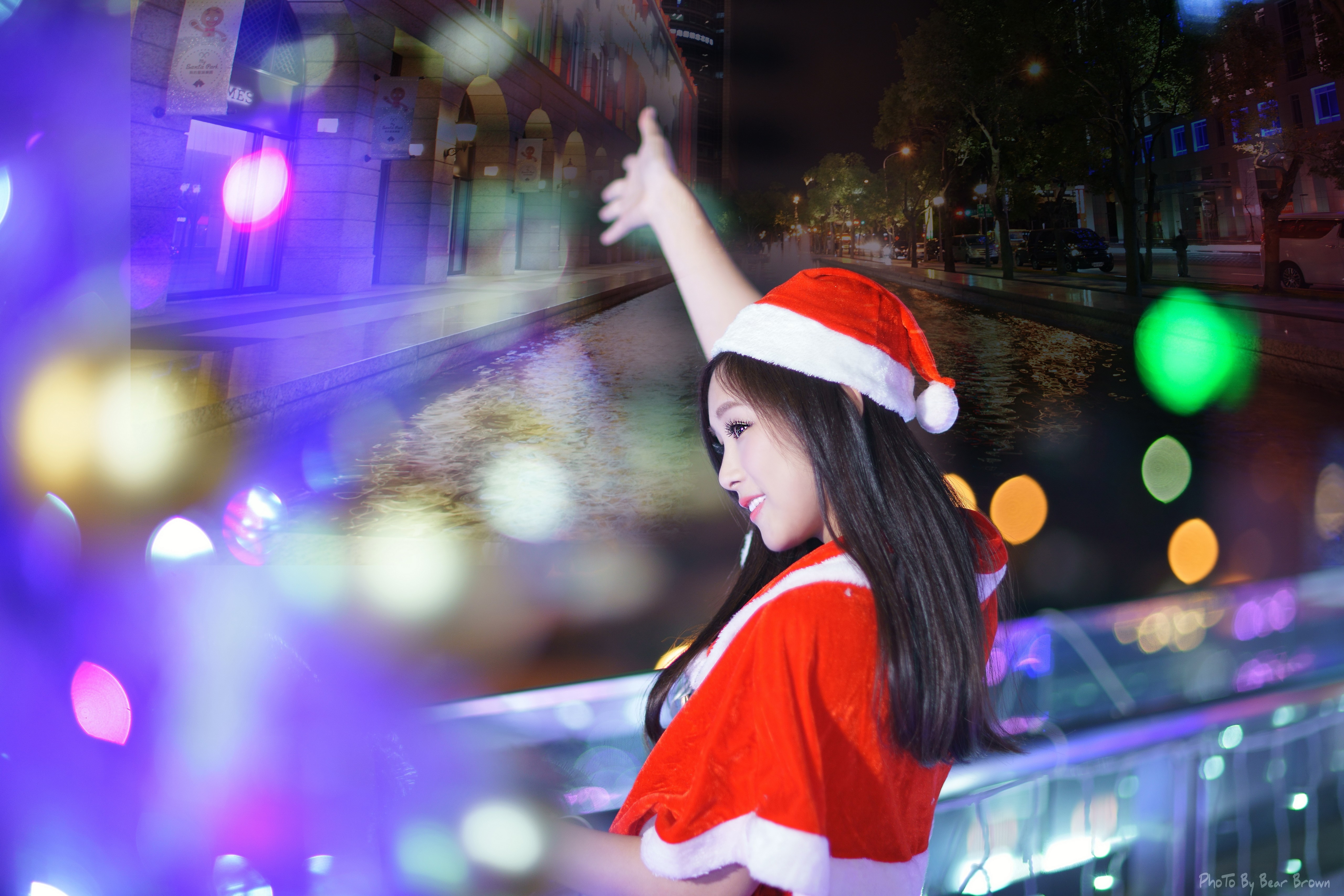 People 5120x3415 Santa hats black hair smiling looking away Christmas lights women Asian model watermarked women outdoors urban makeup