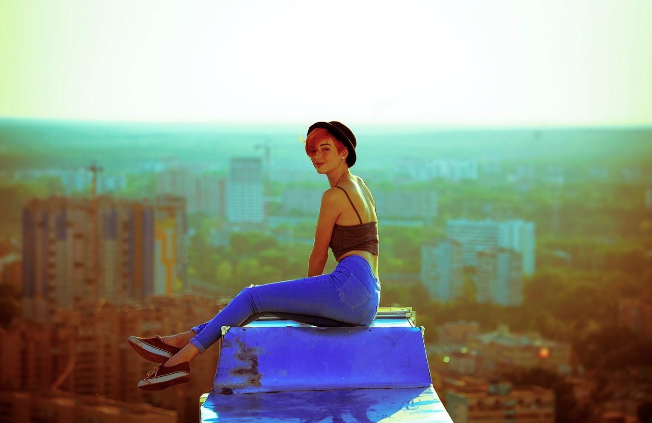 People 1280x831 women Mayya Giter jeans skyline rooftops vents hat redhead looking at viewer short hair women outdoors sitting cityscape women with hats urban red lipstick sneakers Vans (Company)