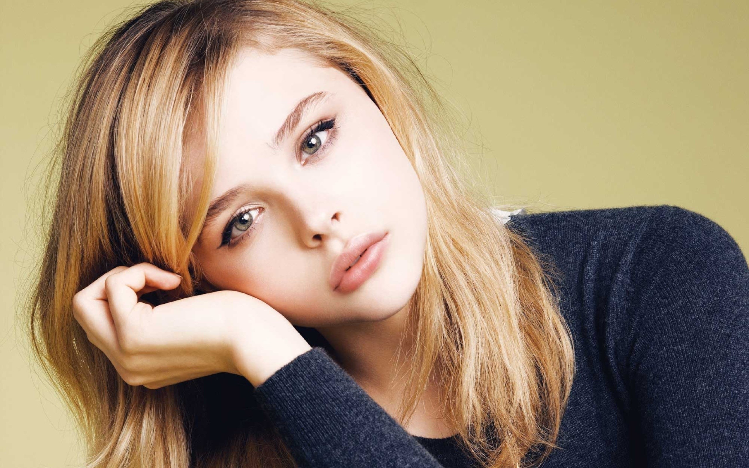 People 2560x1600 actress blonde looking at viewer simple background Chloë Grace Moretz closeup women women indoors indoors studio yellow background face portrait dyed hair sweater