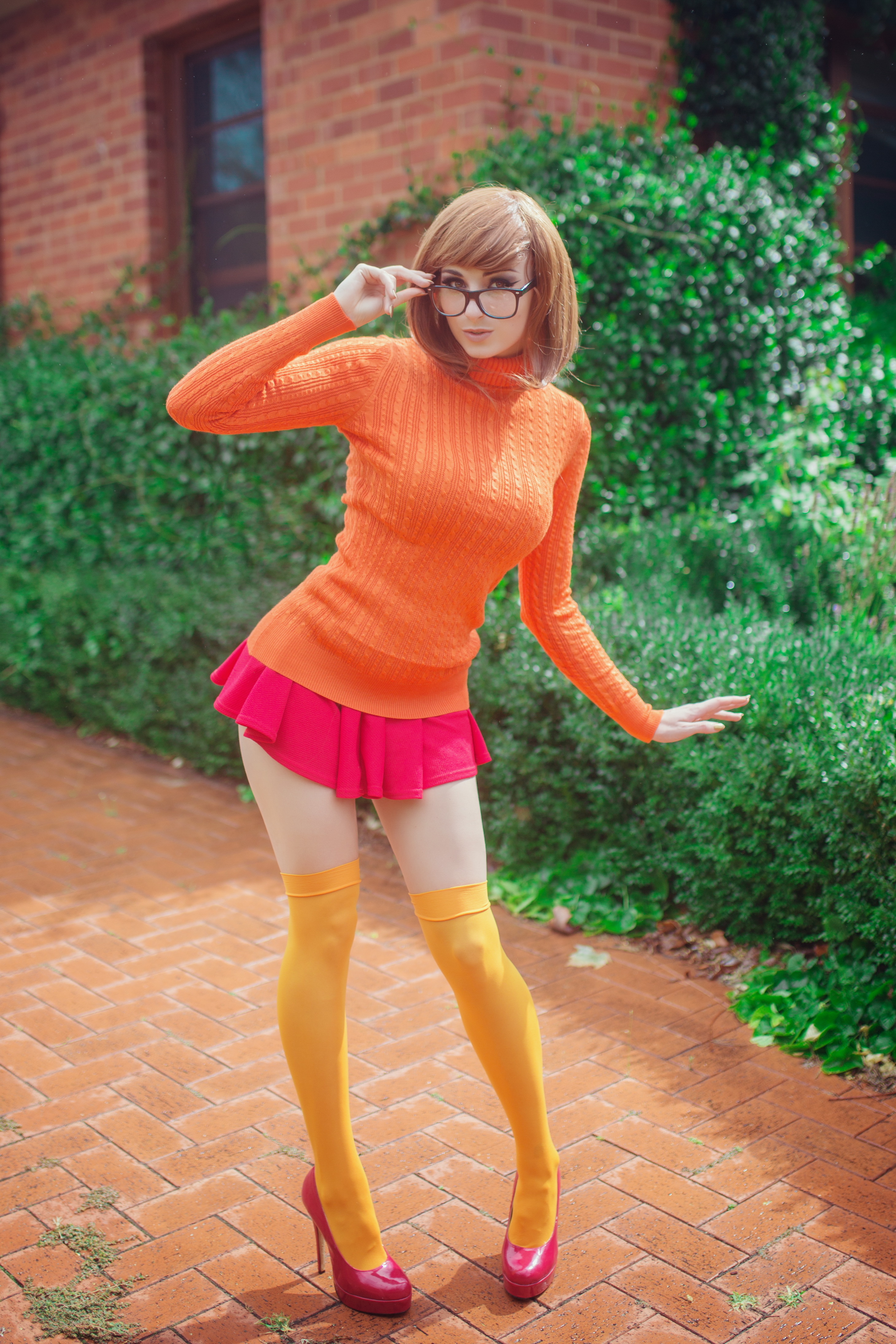 People 2919x4378 Kayla Erin women model women outdoors cosplay Scooby-Doo Velma Dinkley women with glasses turtlenecks sweater miniskirt pink shoes high heels glasses brunette colorful stockings pink skirt zettai ryouiki thigh-highs shoes standing