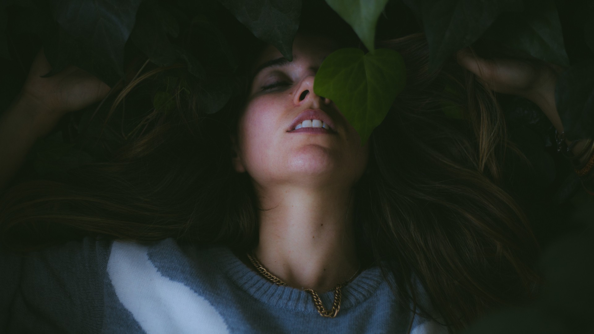 People 1920x1080 leaves plants closed eyes face women model brunette diffused long hair sweater closeup