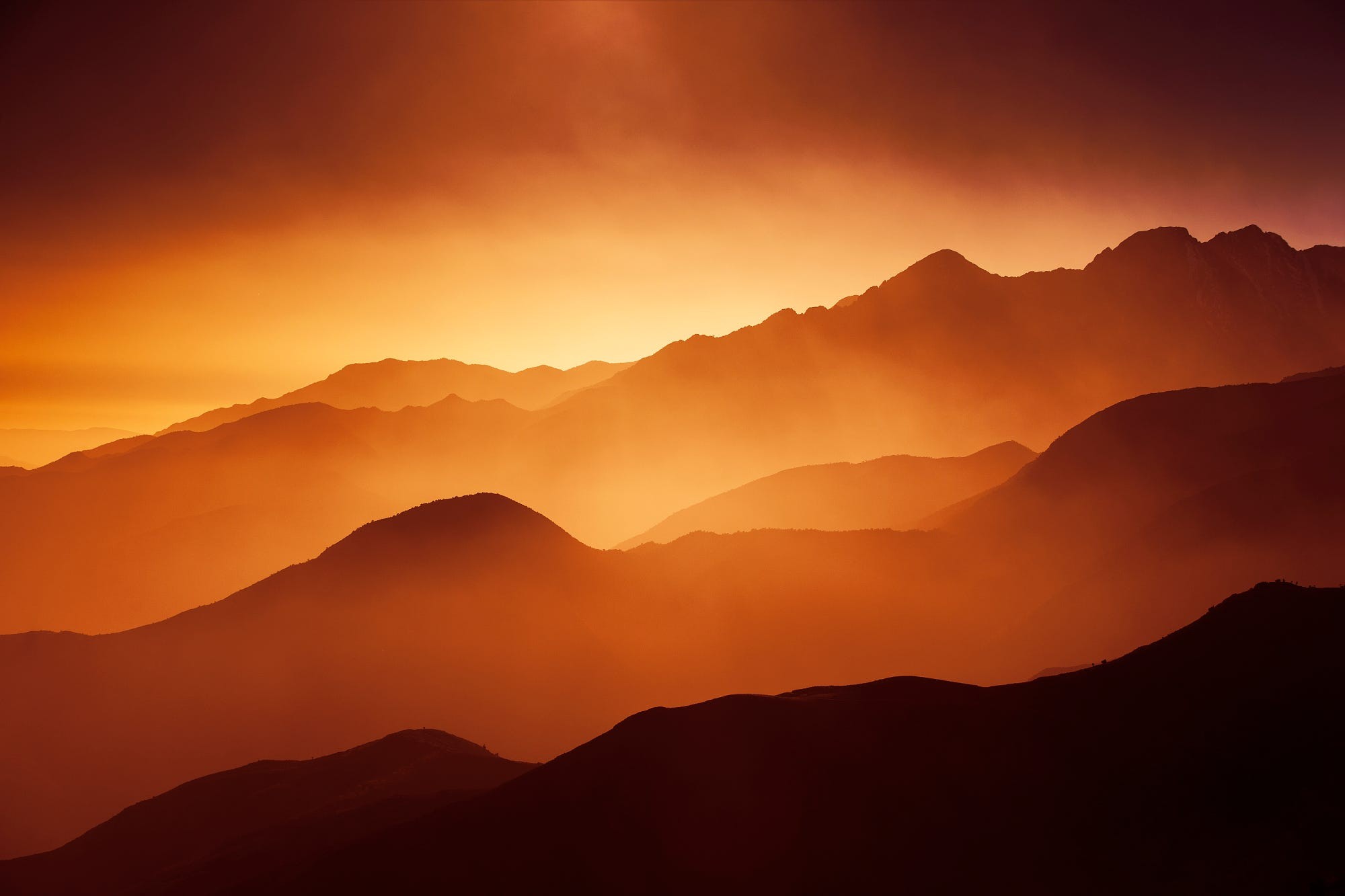 General 2000x1333 nature landscape mountains mist sunlight orange red silhouette