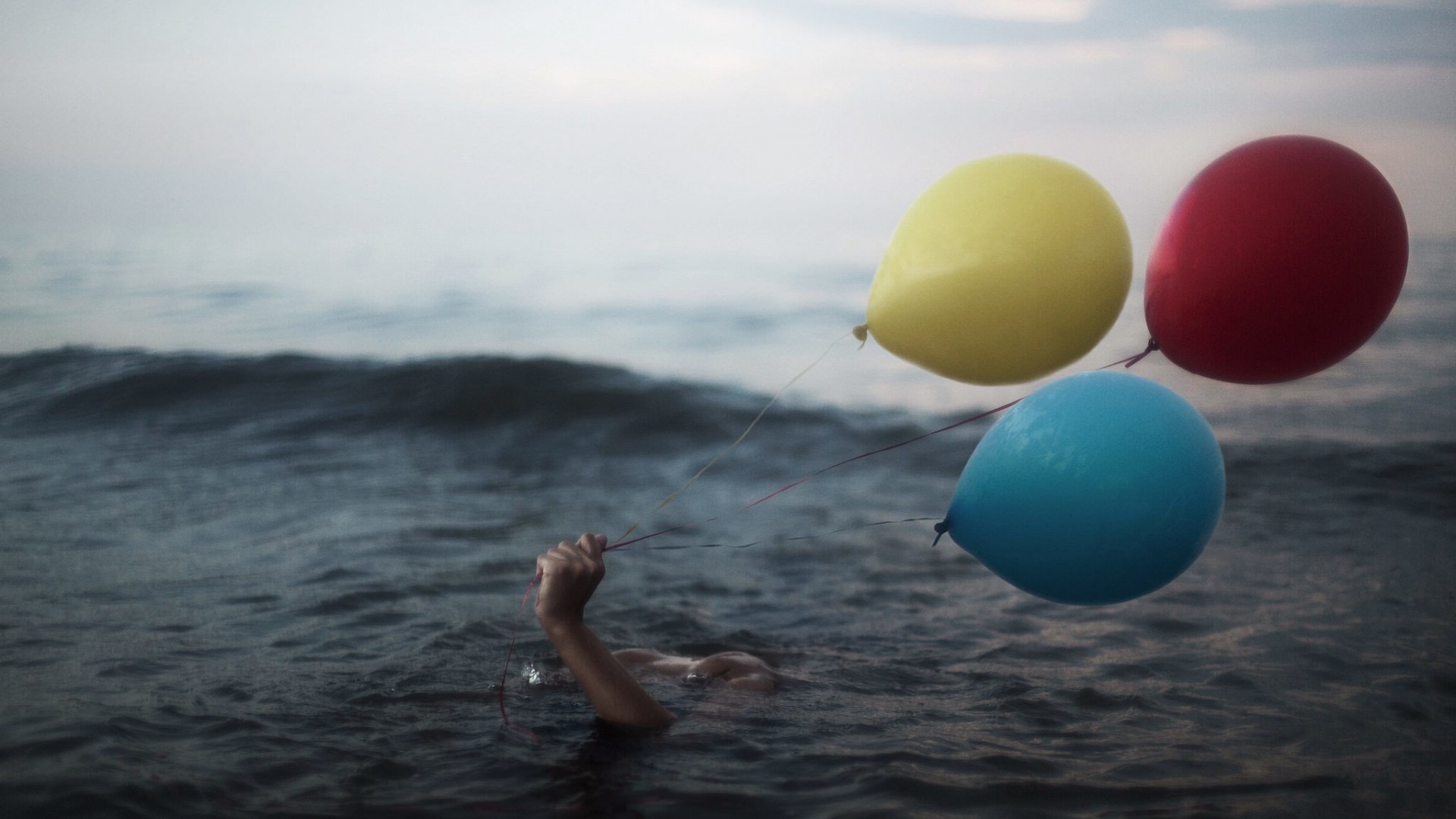 General 1920x1080 hands balloon water sea swimming waves yellow red blue in water