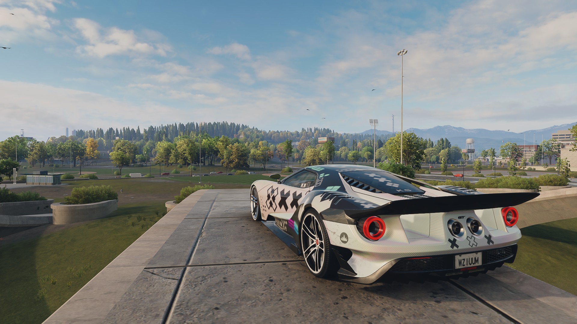 General 1920x1080 Need for speed Unbound clouds Ford GT landscape video games screen shot sky rear view licence plates car CGI trees