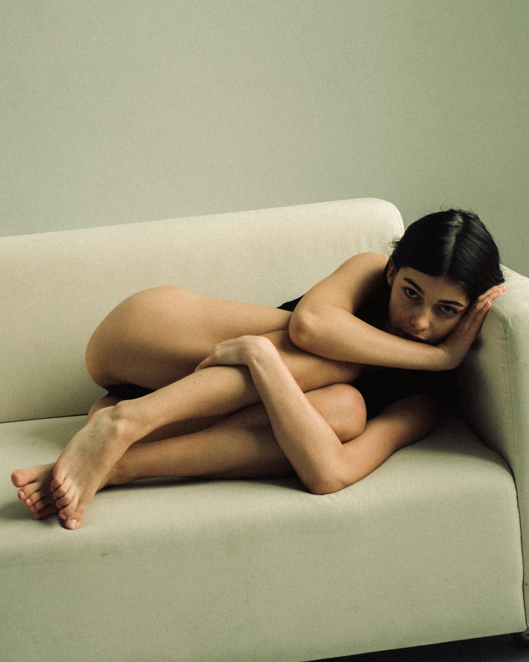 People 1728x2160 Tanya Asmodeus women dark hair black lingerie looking at viewer holding knees whole body holding leg(s) bent legs lying on side on the couch fetal position barefoot lying on couch indoors women indoors