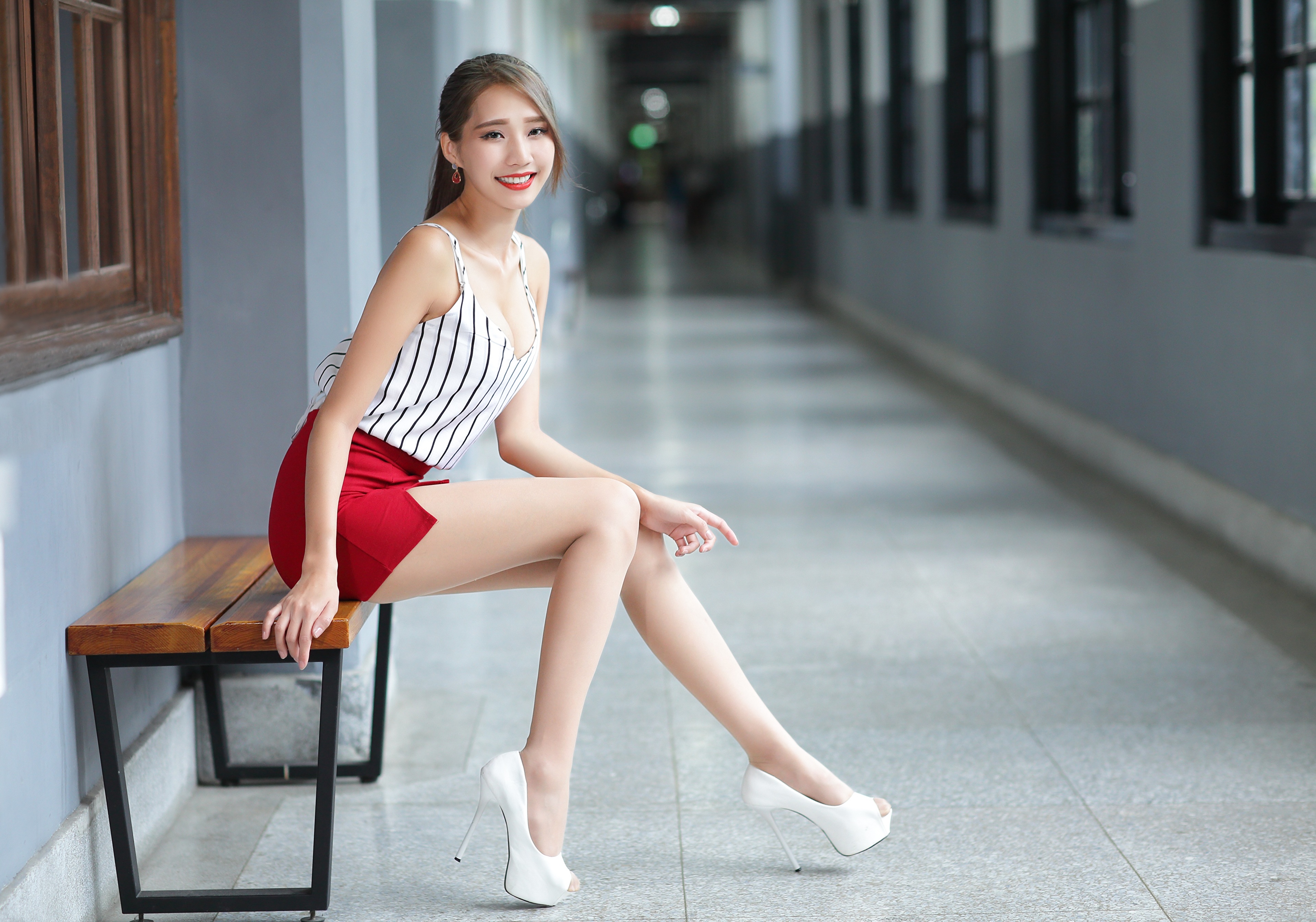 People 3840x2692 Asian model women long hair dark hair sitting bench red skirt white high heels striped shirt ponytail earring hallway window depth of field high heels heels office girl white heels miniskirt red miniskirt arched back cleavage legs pantyhose red lipstick looking at viewer